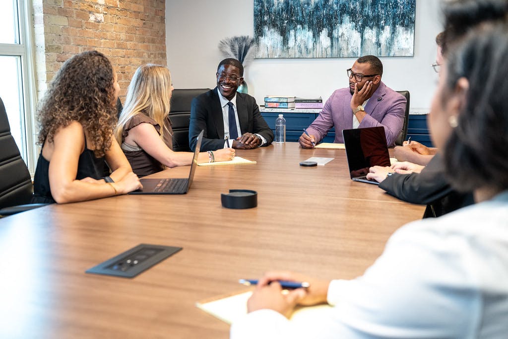 A photo of David in a boardroom