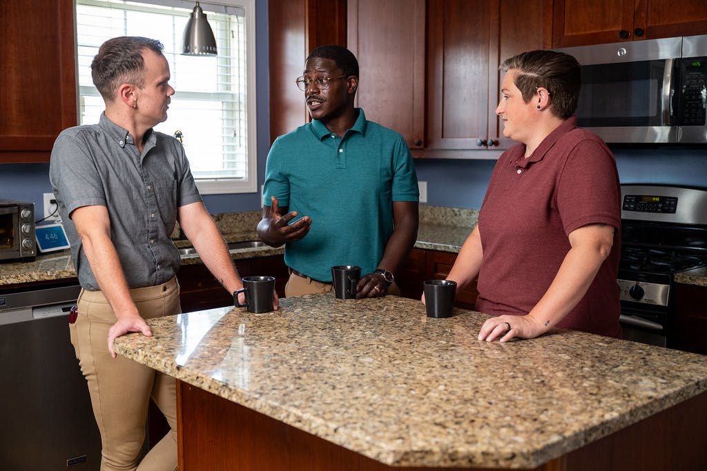 A photo of David having a kitchen conversation