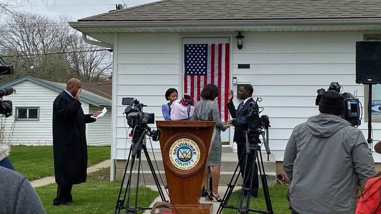 A photo of David being sworn in as County Executive