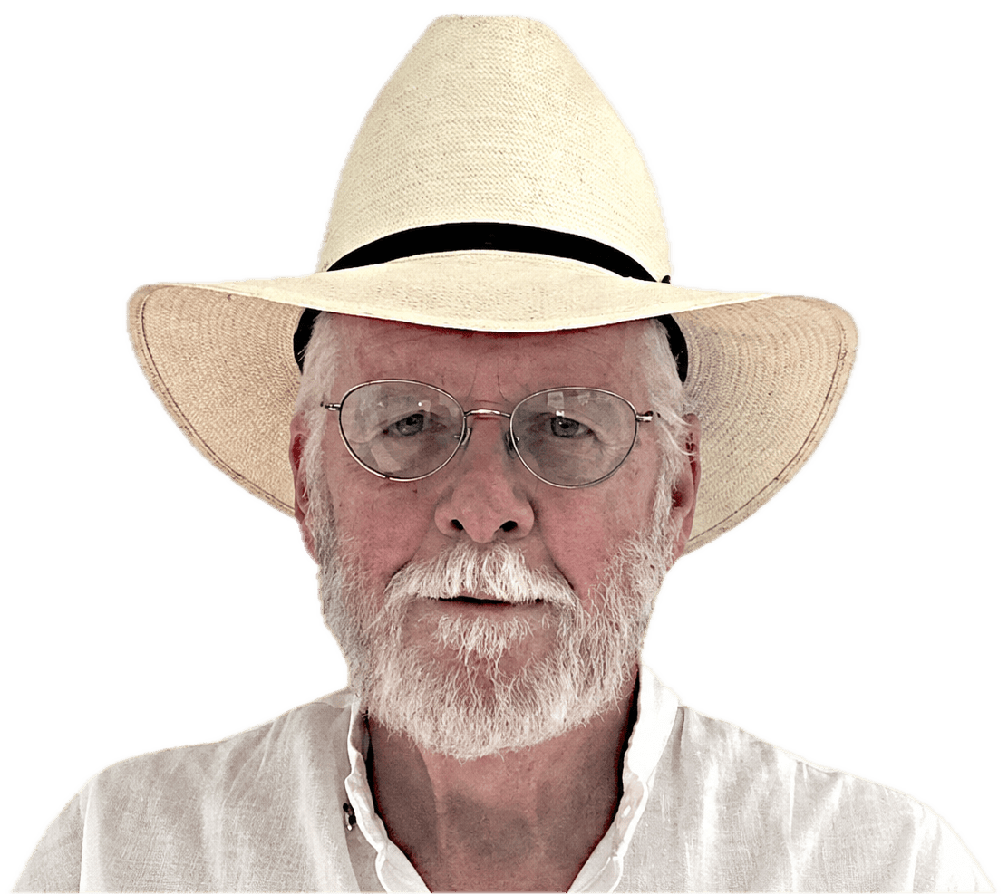 Thomas John “Tom” Wakely standing near the Florida Mountains with the New Mexico flag in Luna County