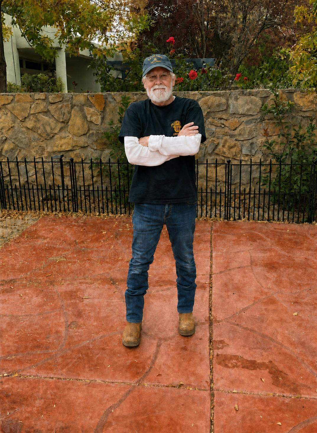 Thomas John Wakely "Tom" standing on his backyard patio
