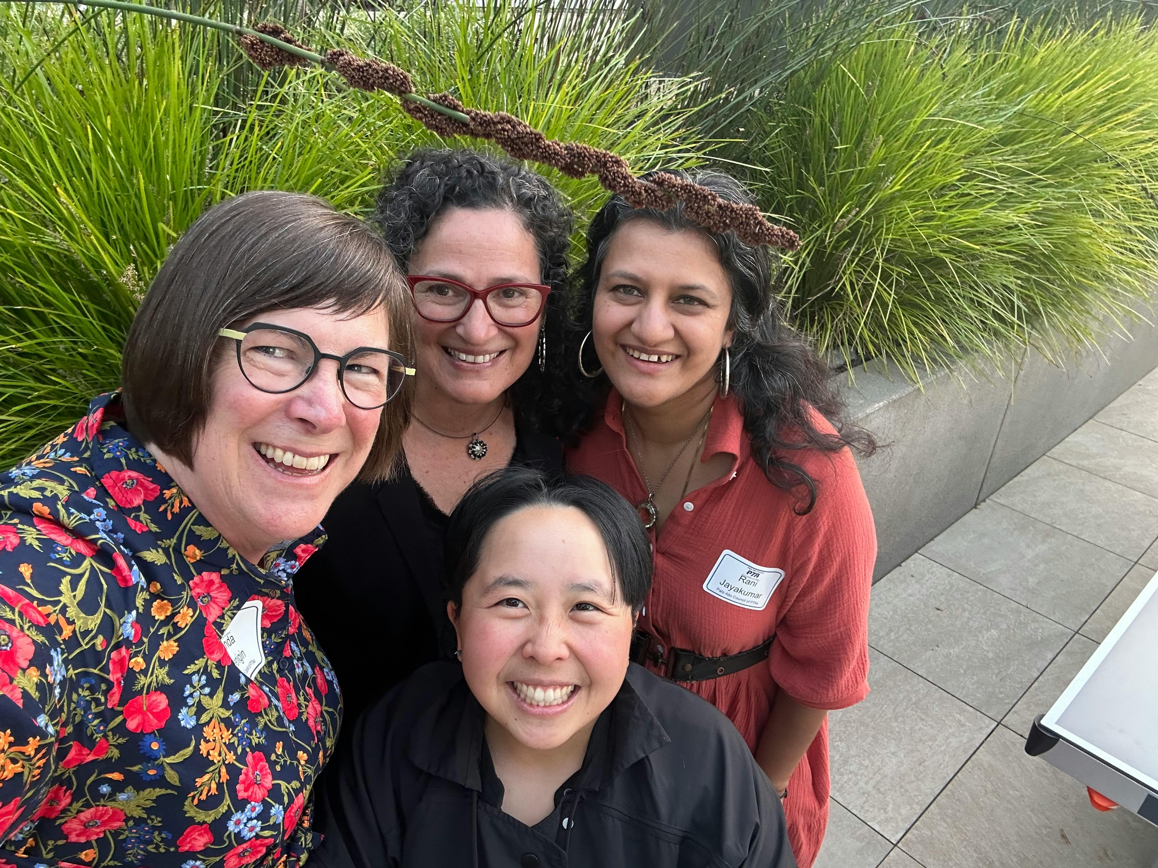Linda, Debbie, rani and Peying smiling at the camera