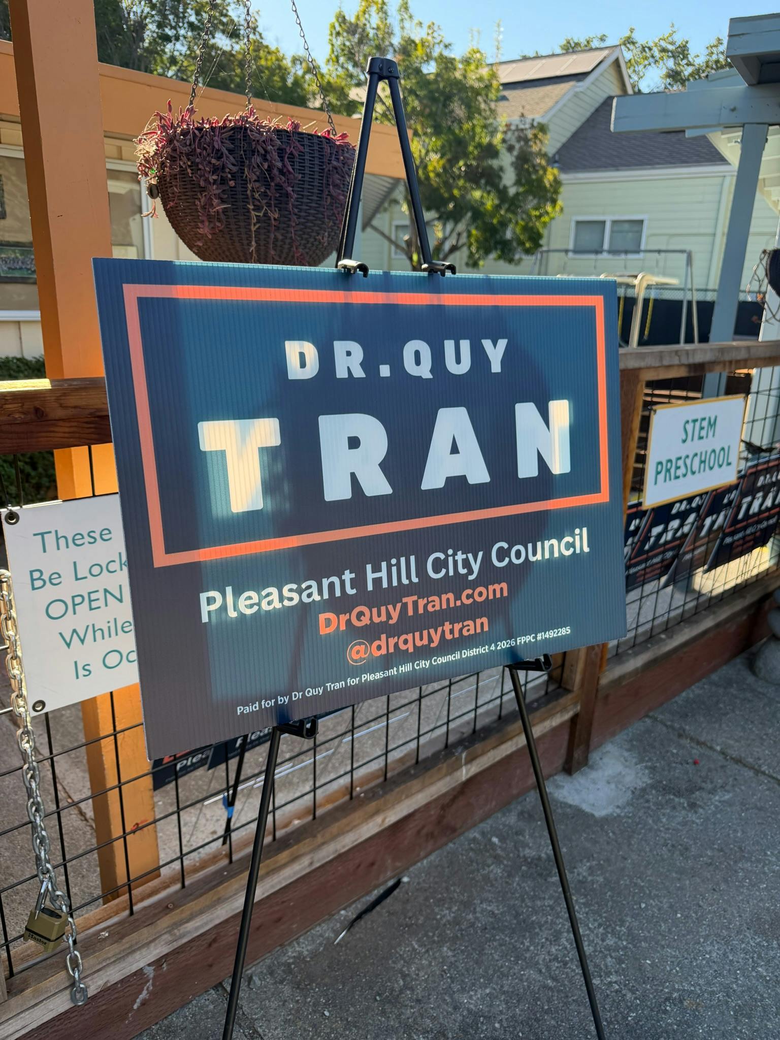Photo of sign for Dr. Quy Tran with web address DrQuyTran.com