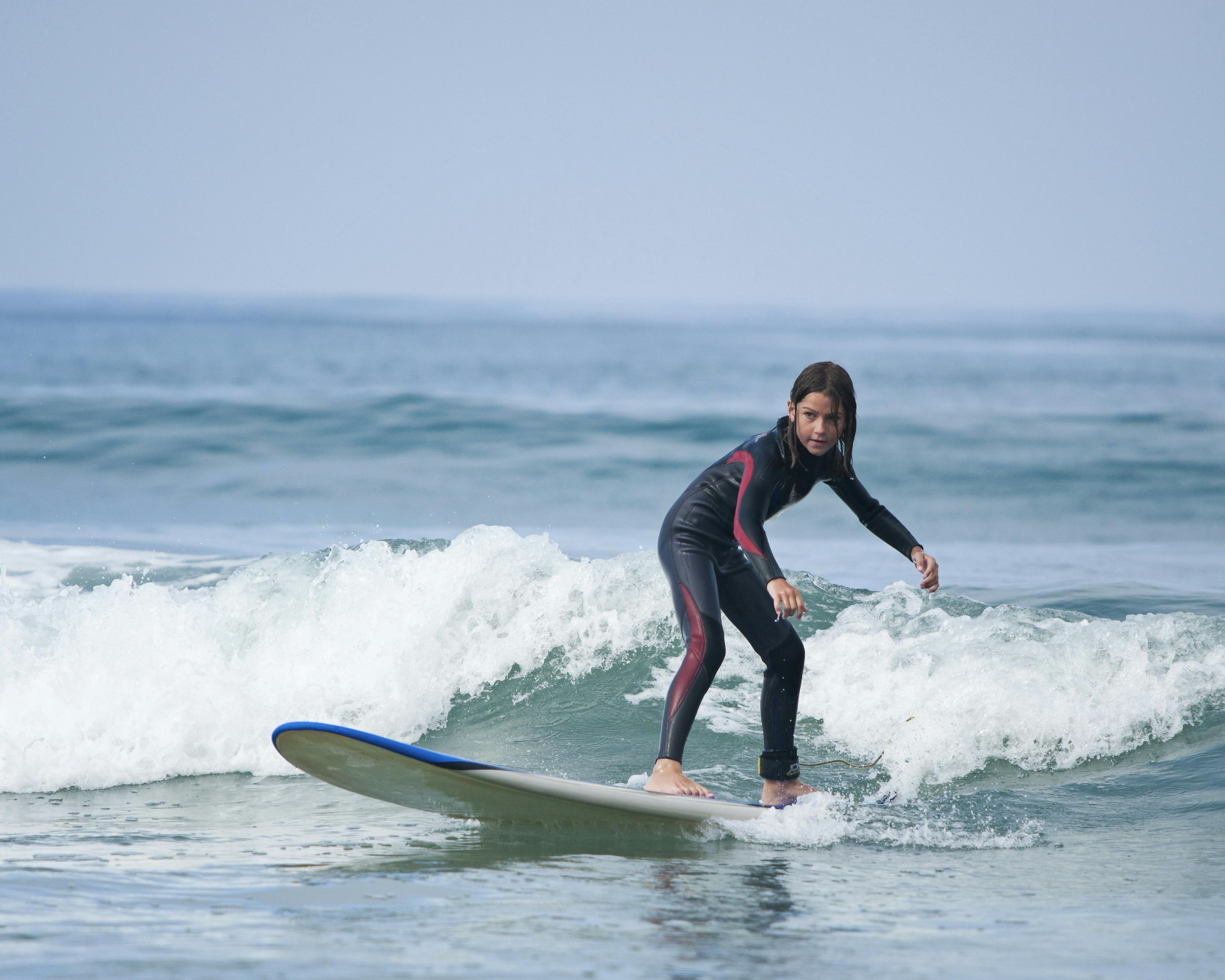 Young girl surfing