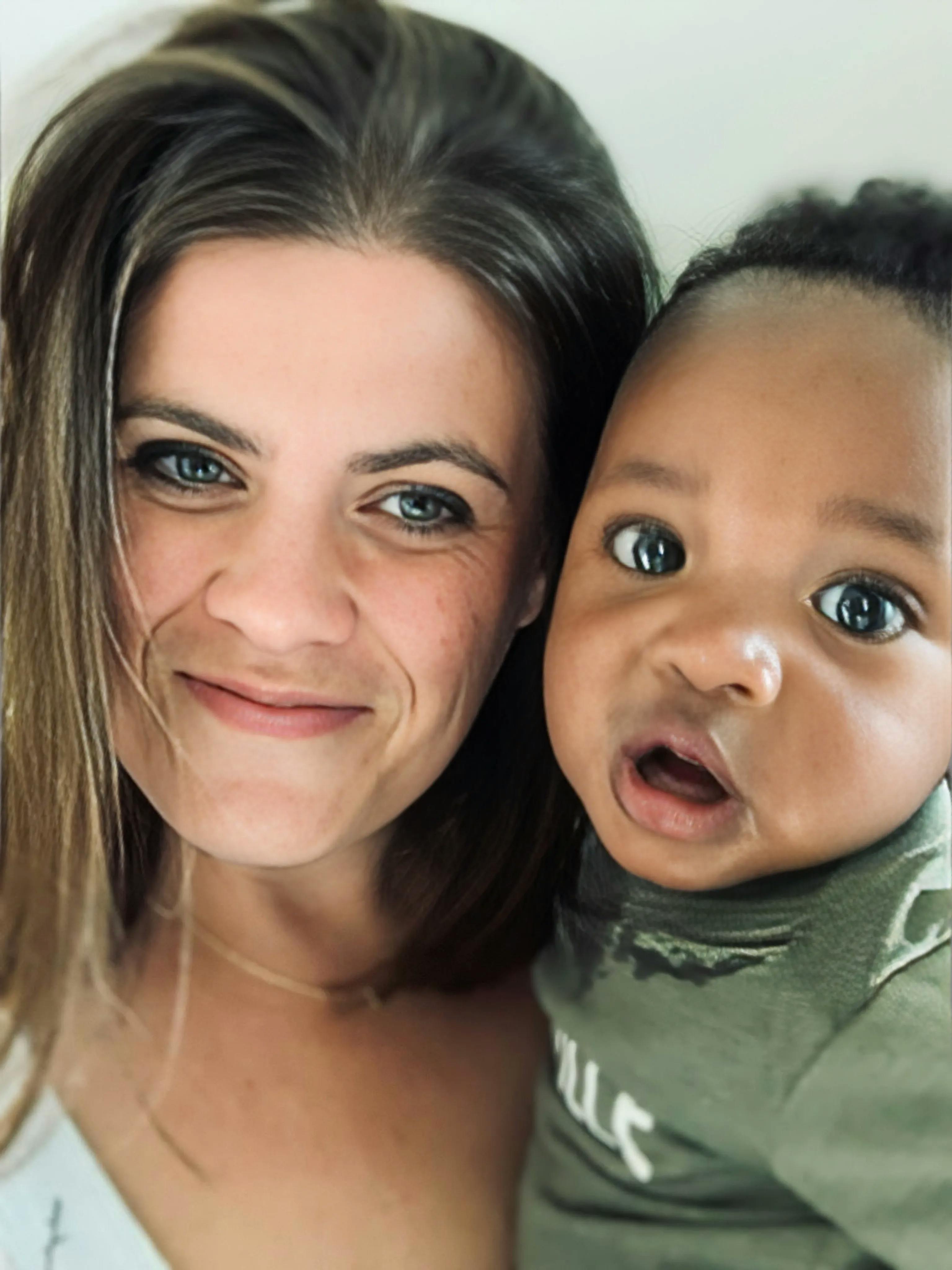 Portrait of director smiling with child
