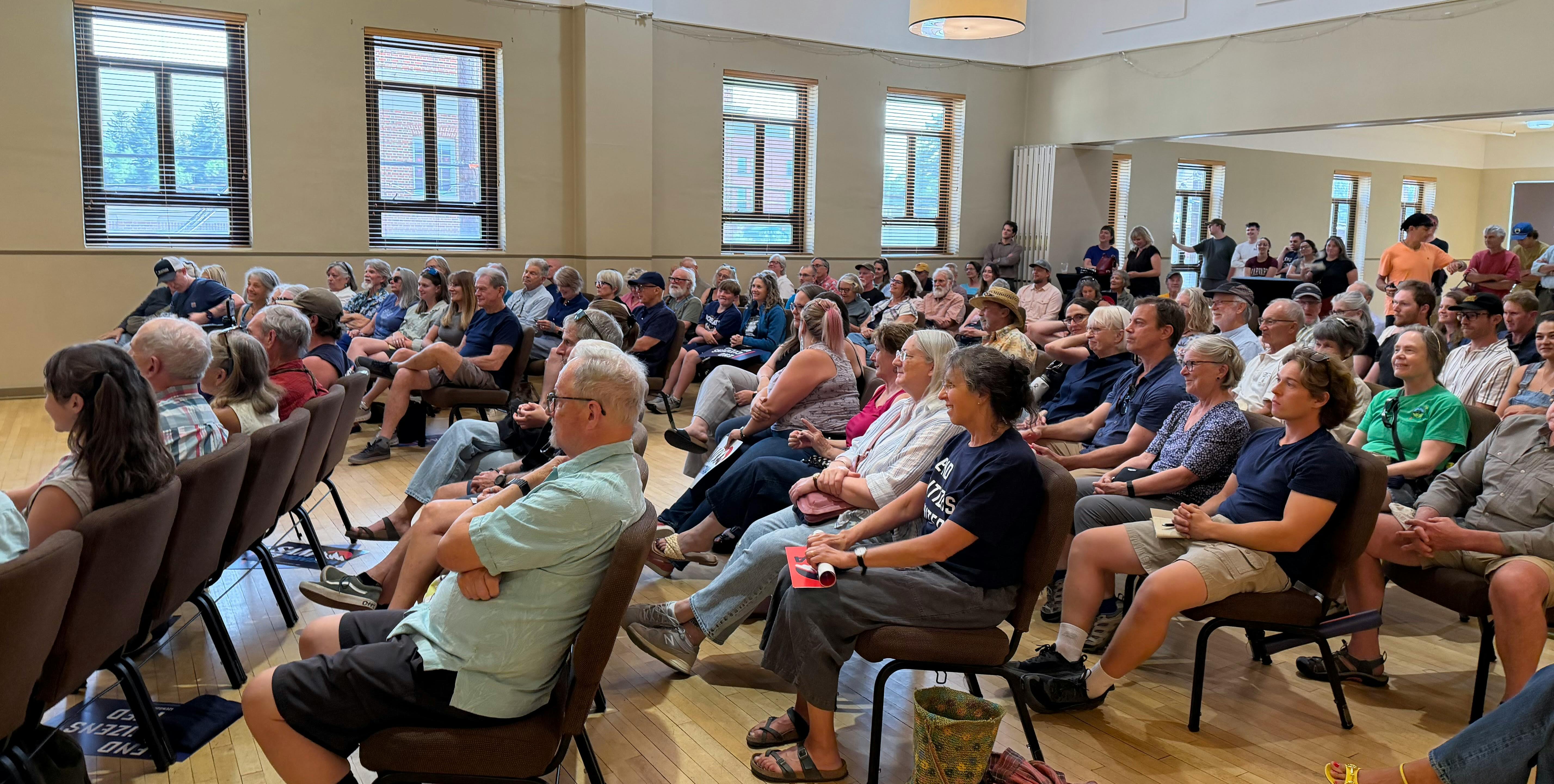 Full room at ECU town hall with Sam Forstag. Audience is seated.