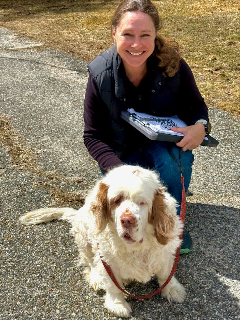 Candidate kneeling with dog
