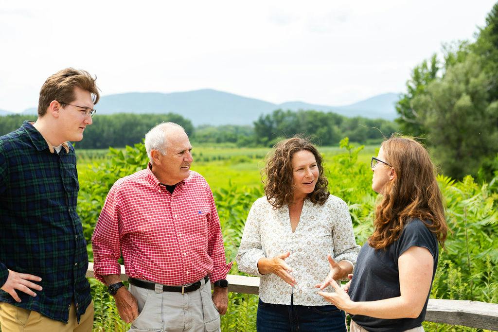 Candidate speaking with others outdoors