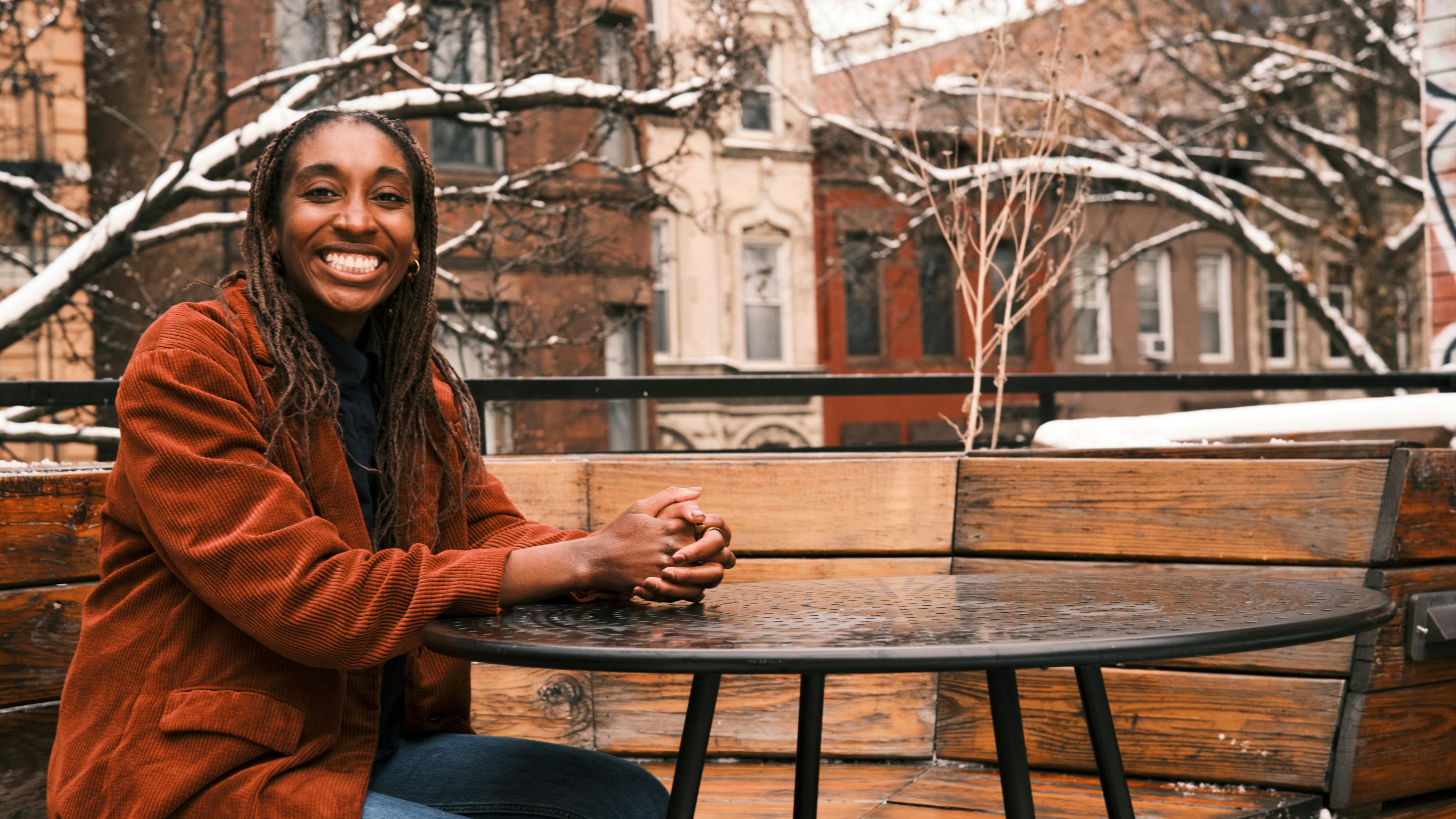 Photo of Christina Cover smiling outside, hanging around her Bronx neighborhood