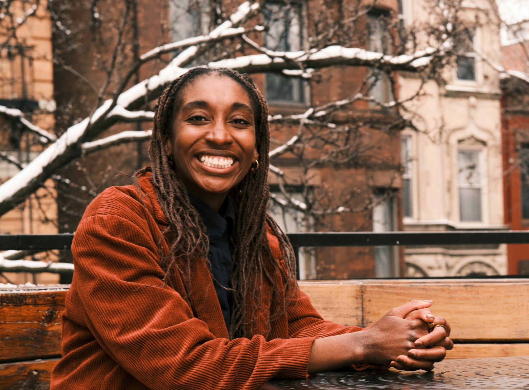 Photo of Christina Cover smiling outside, hanging around her Bronx neighborhood
