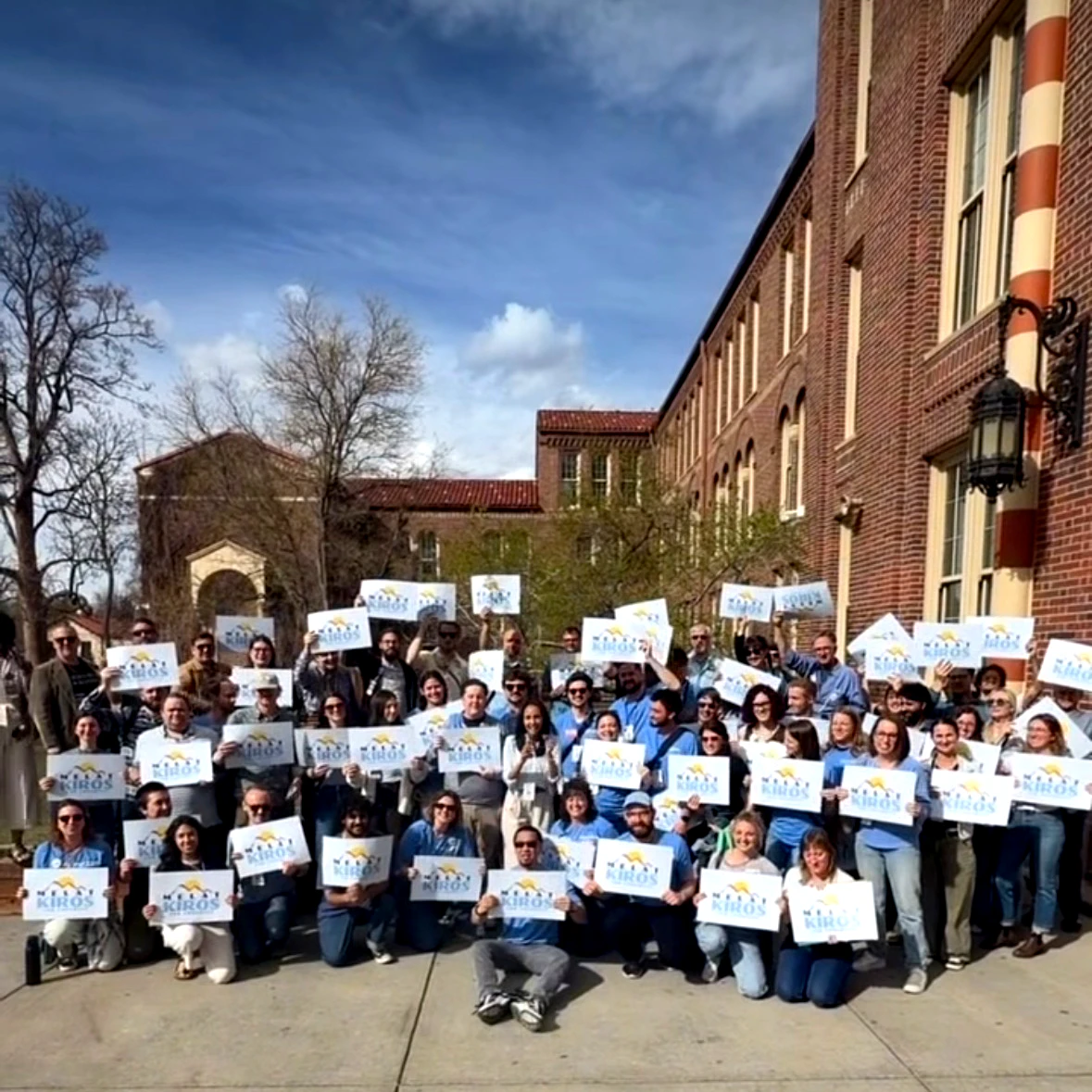 Candid photo of volunteers interacting outside in a public park
