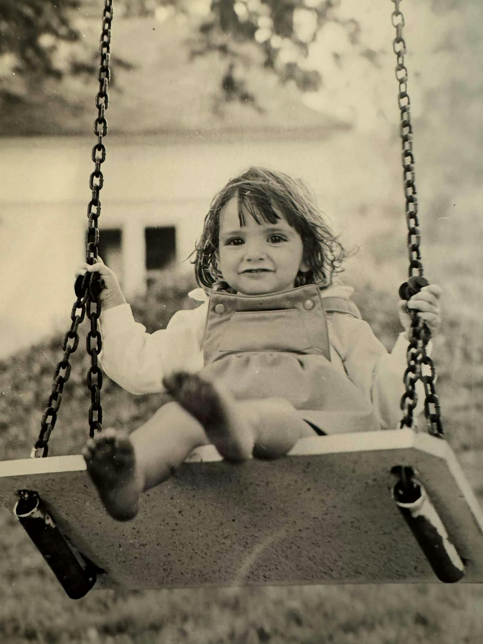 little Sarah swinging