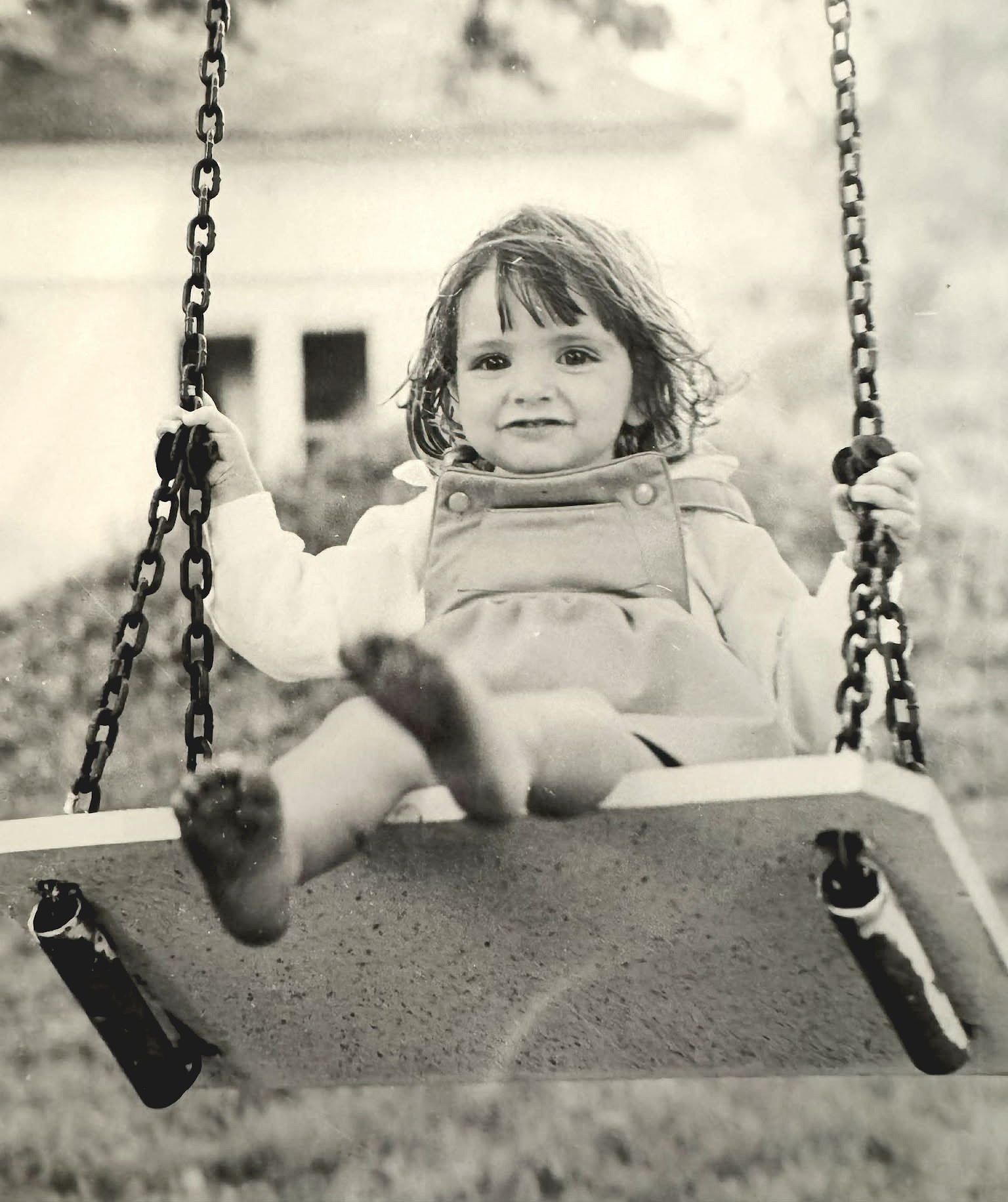 little Sarah swinging