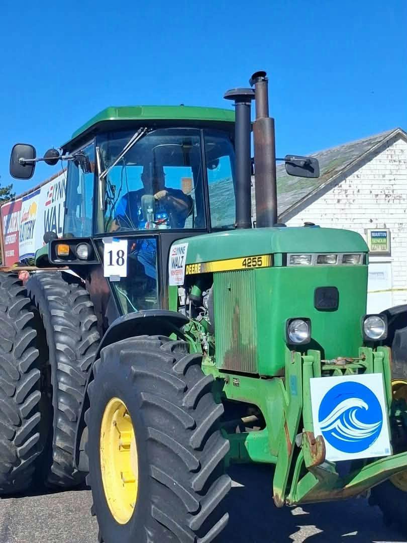 Tractor pulling a parade float