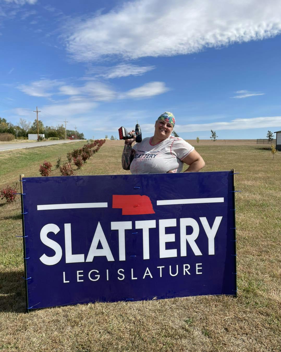 Sarah placing campaign sign