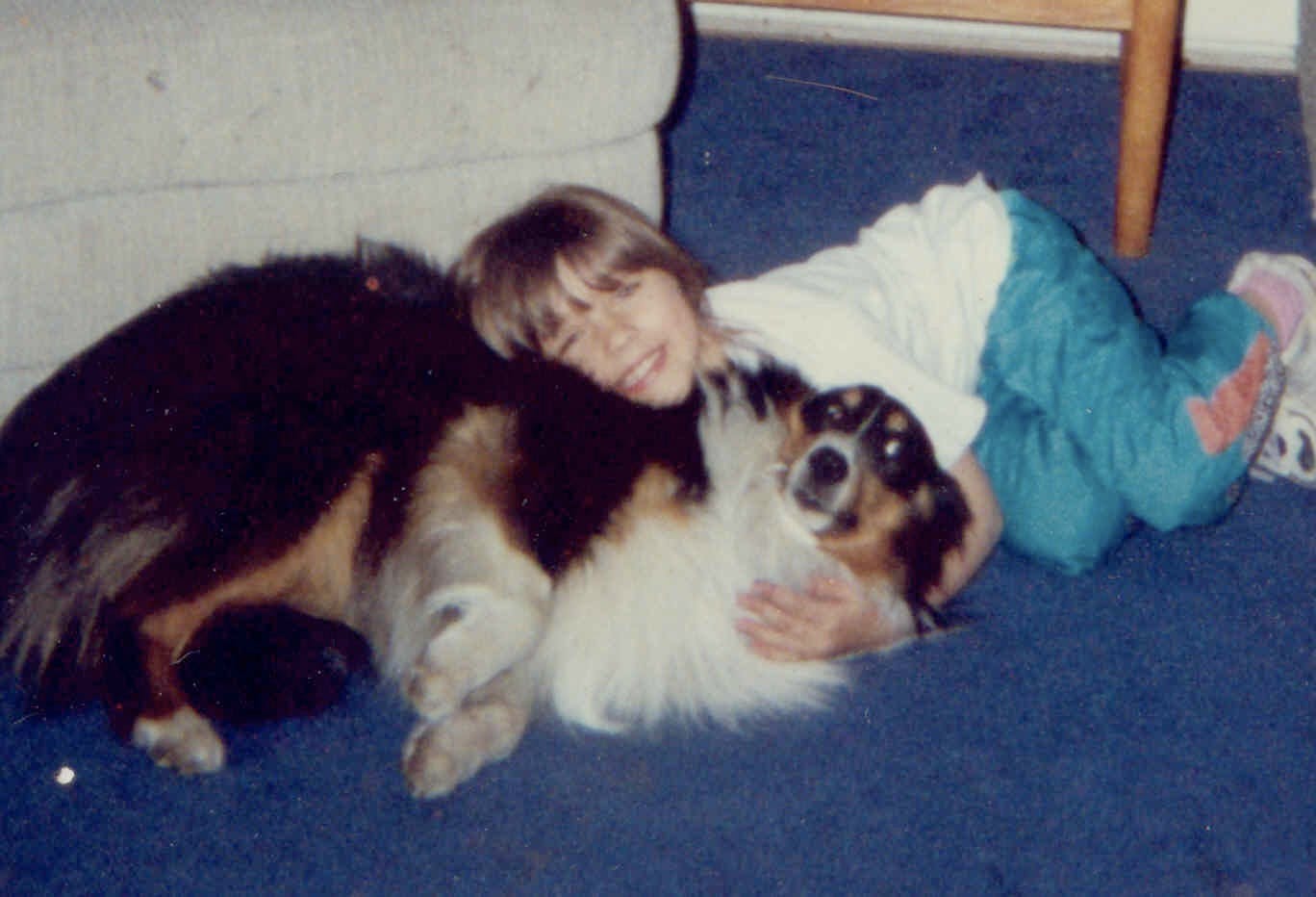 Mariah as a child with Jasper, their childhood dog