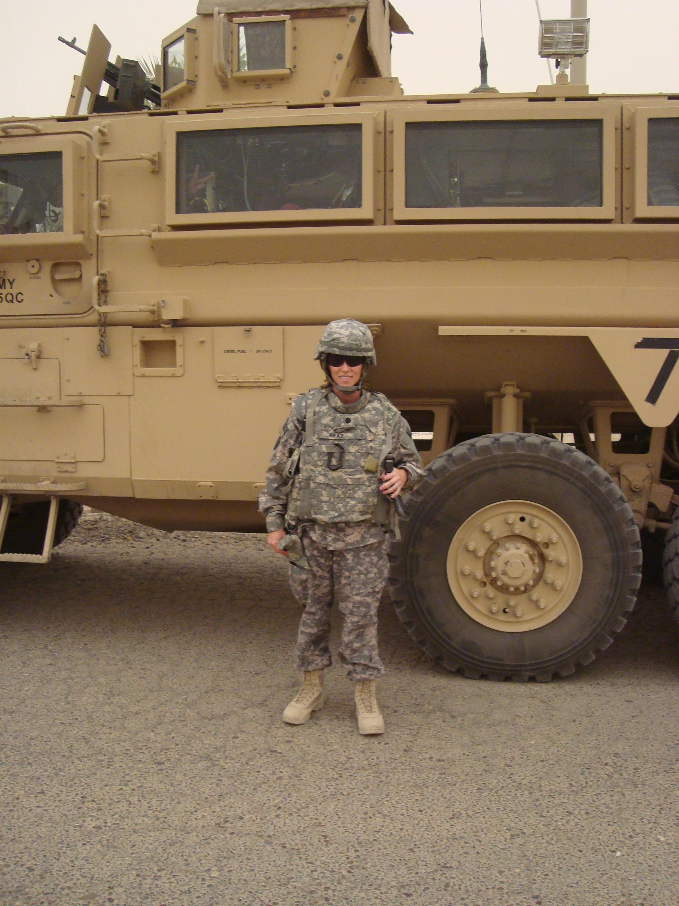 Portrait of candidate in front of a tank