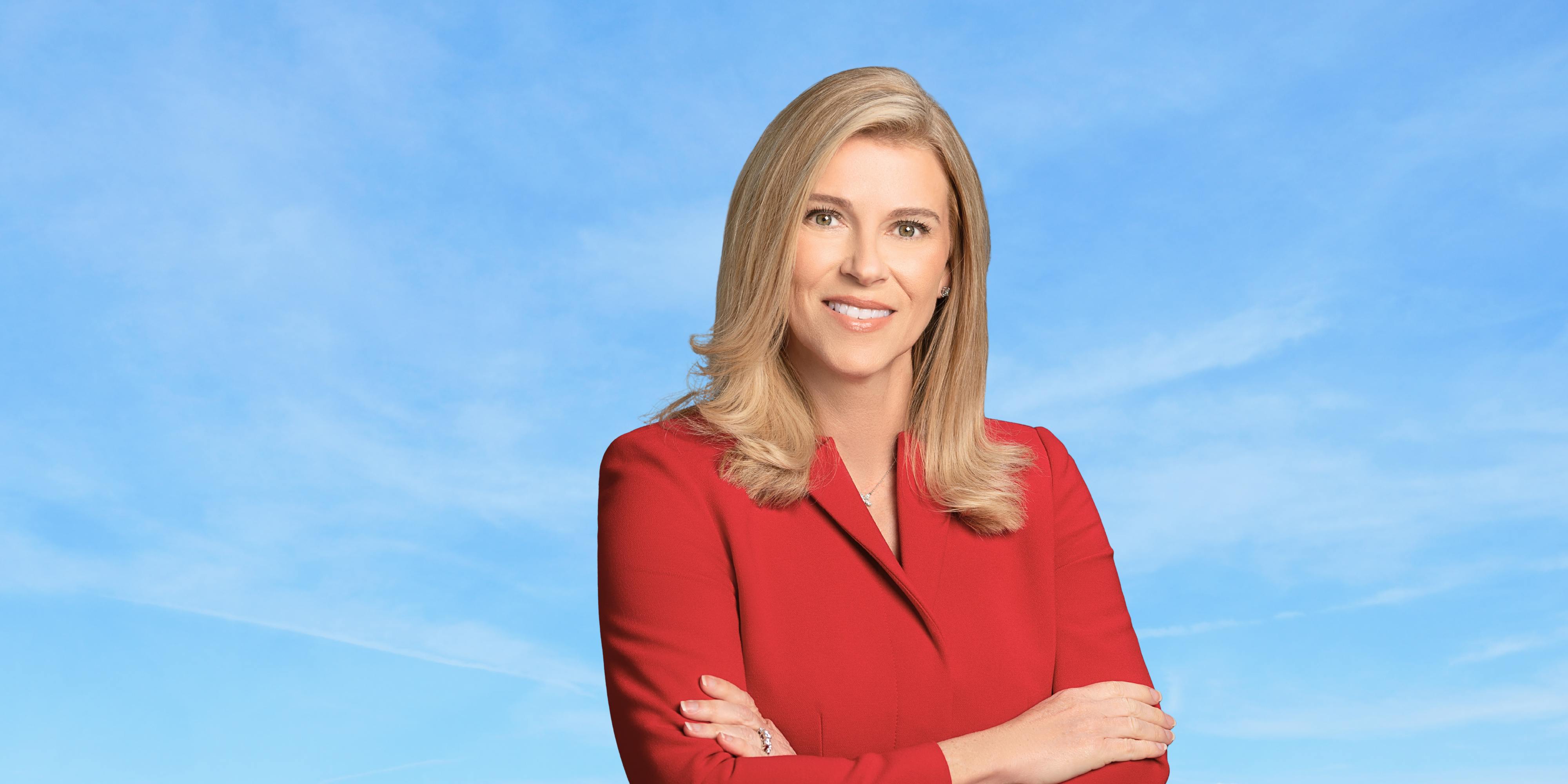 Leela Gray Smiling with Blue Sky Background