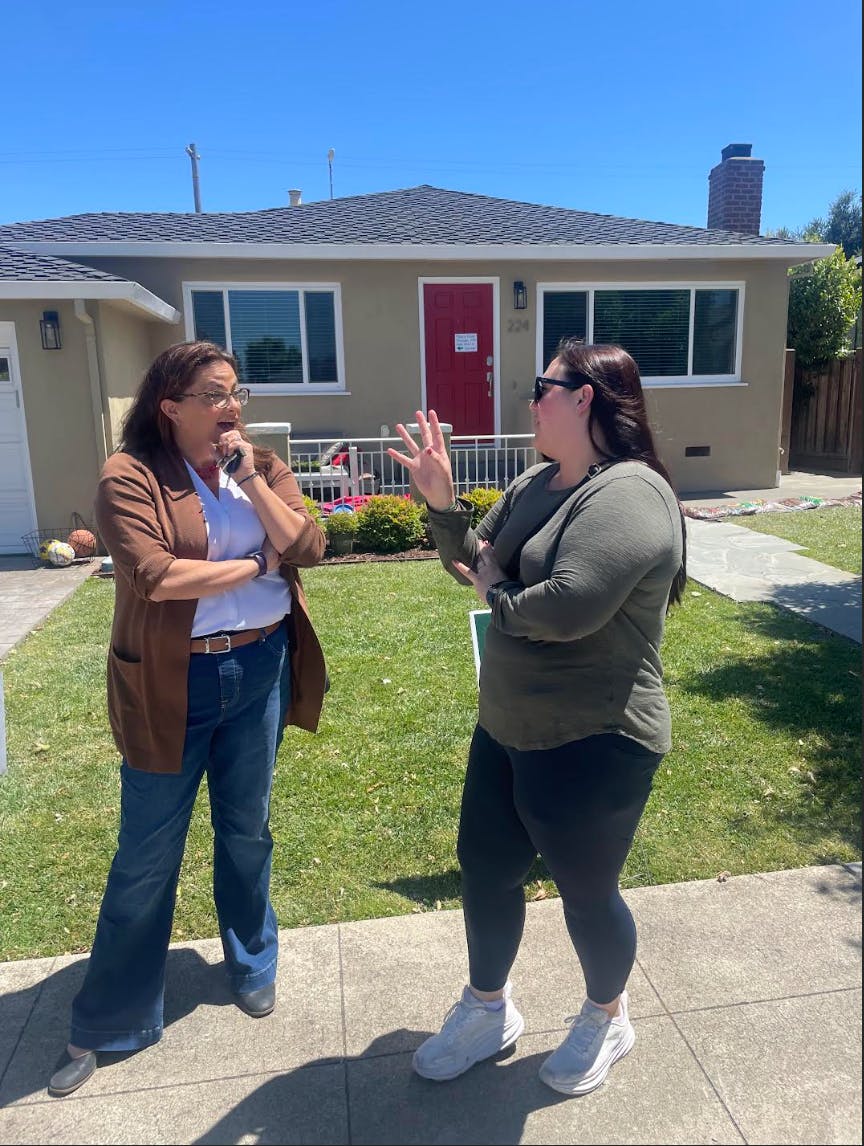 Dana talking with resident