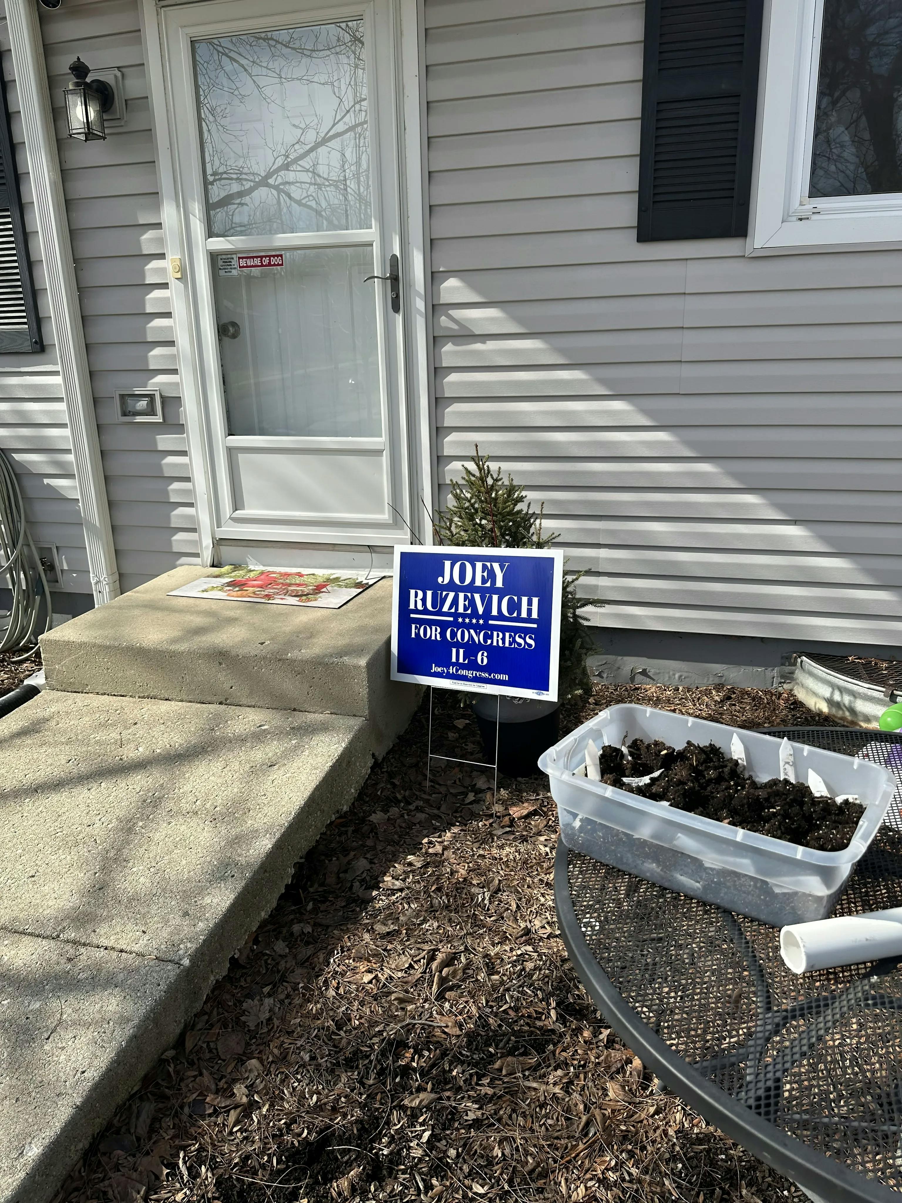 image of Joey's yard sign in front of a suburban home