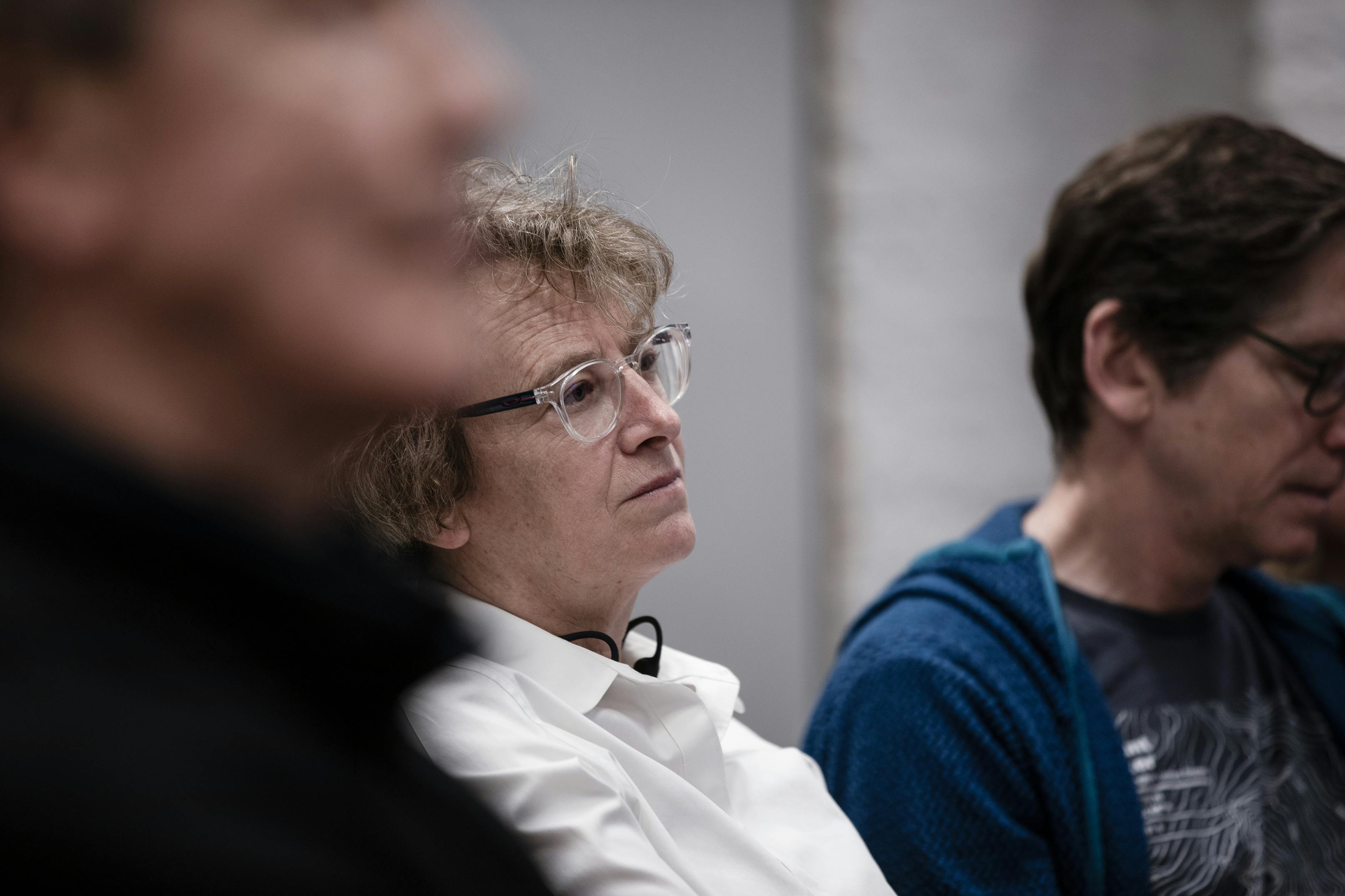 portrait of Nina Schwalbe with two people out of focus