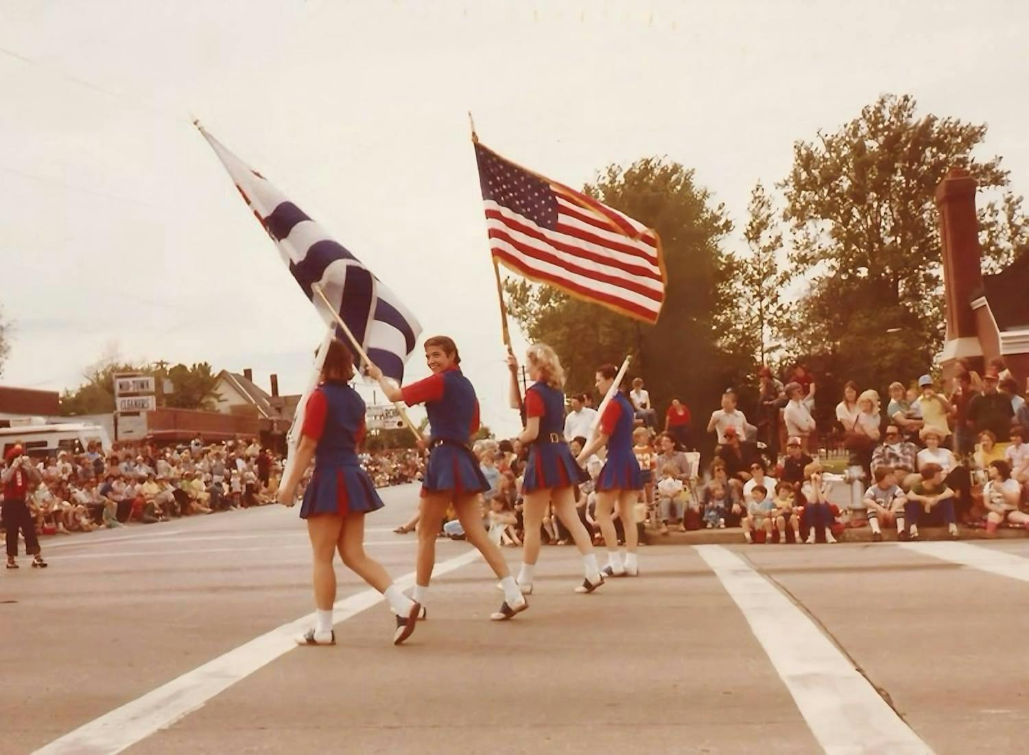 Valley of Flowers Parade, Old Town Florissant, 1981. Joan is waving the blue-and-white flag!