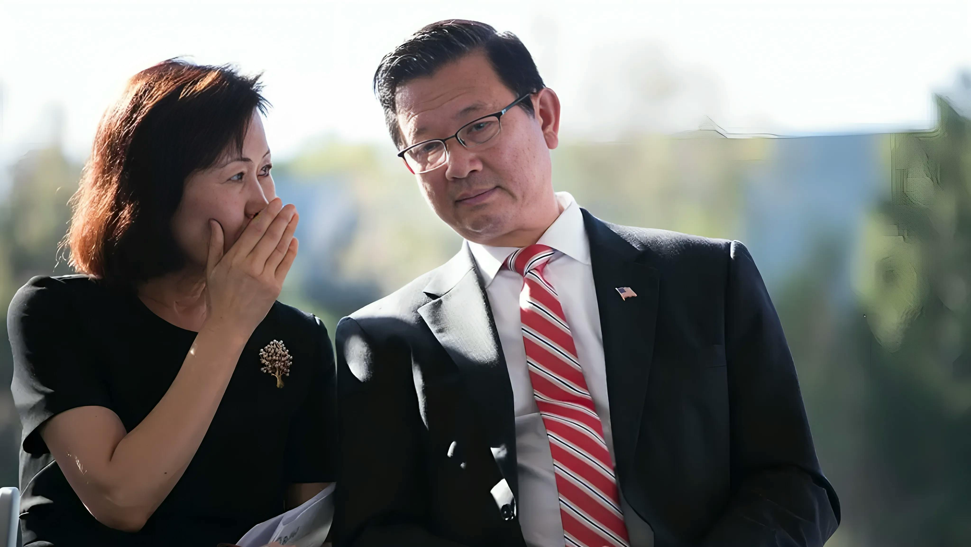 Picture of Michelle Steel whispering to Andrew Do