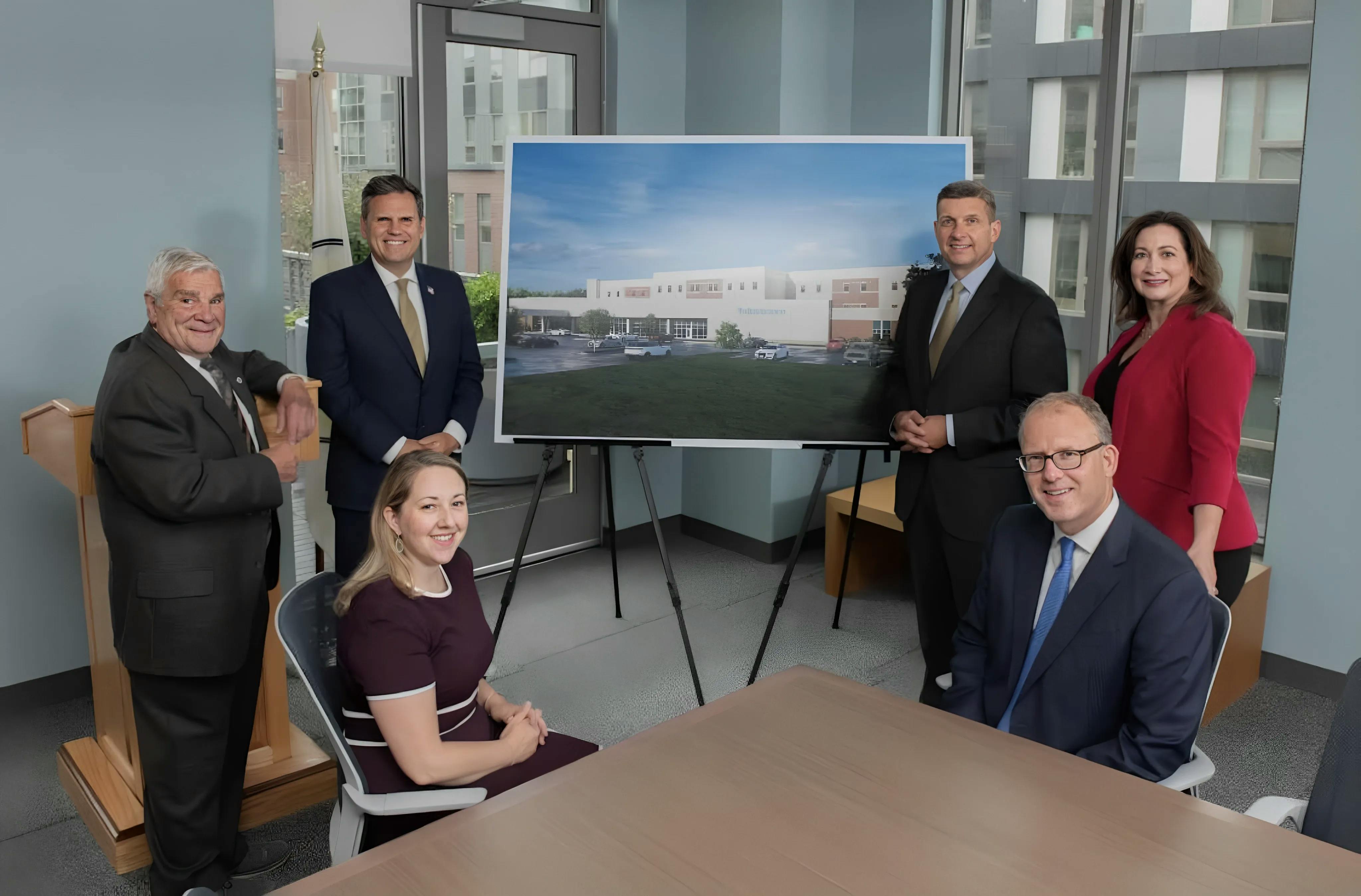 Malden City Leaders with a rendering of the new Malden Hospital site