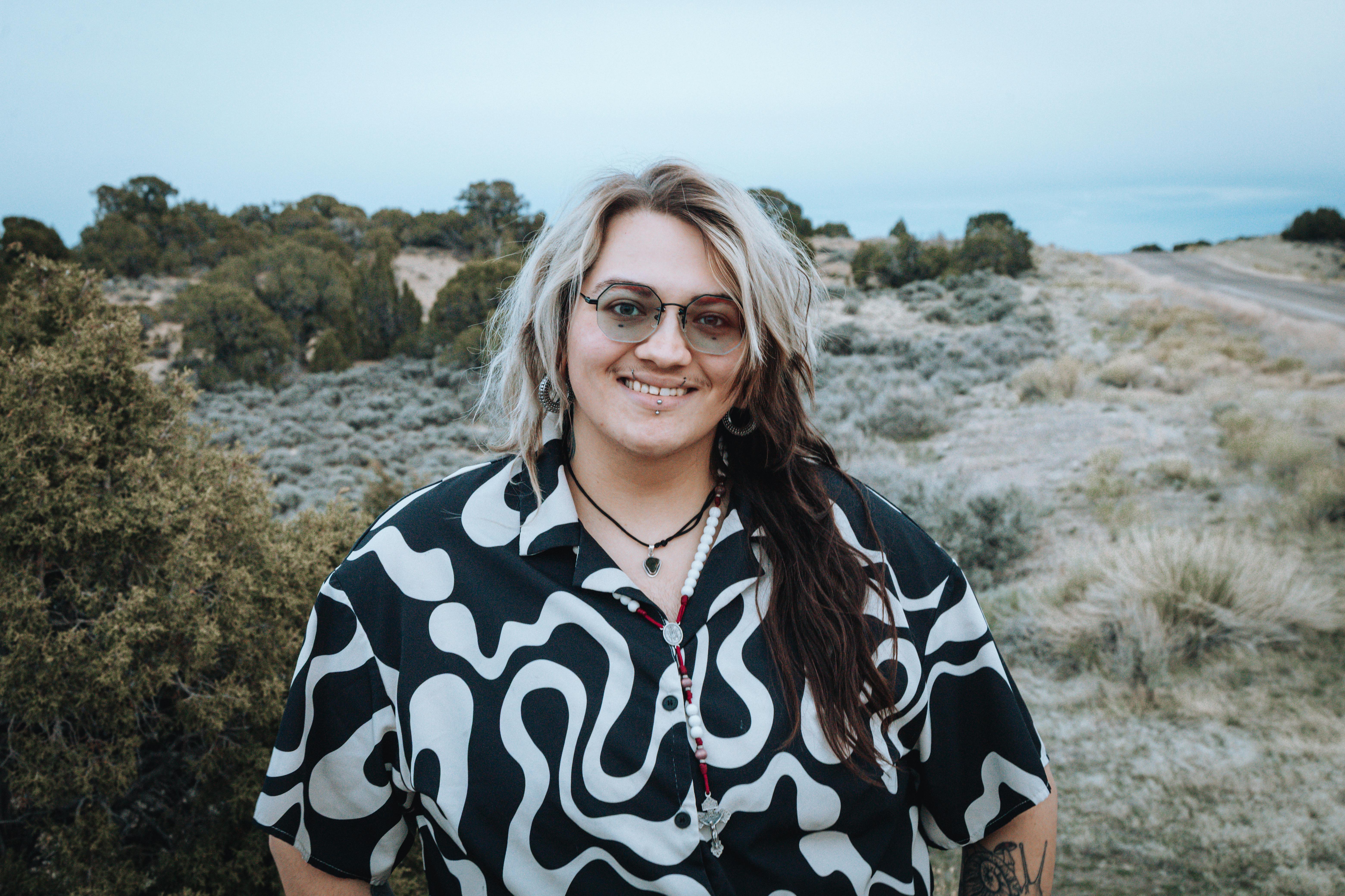 portrait of Rah smiling while out in the hills of Sweetwater county