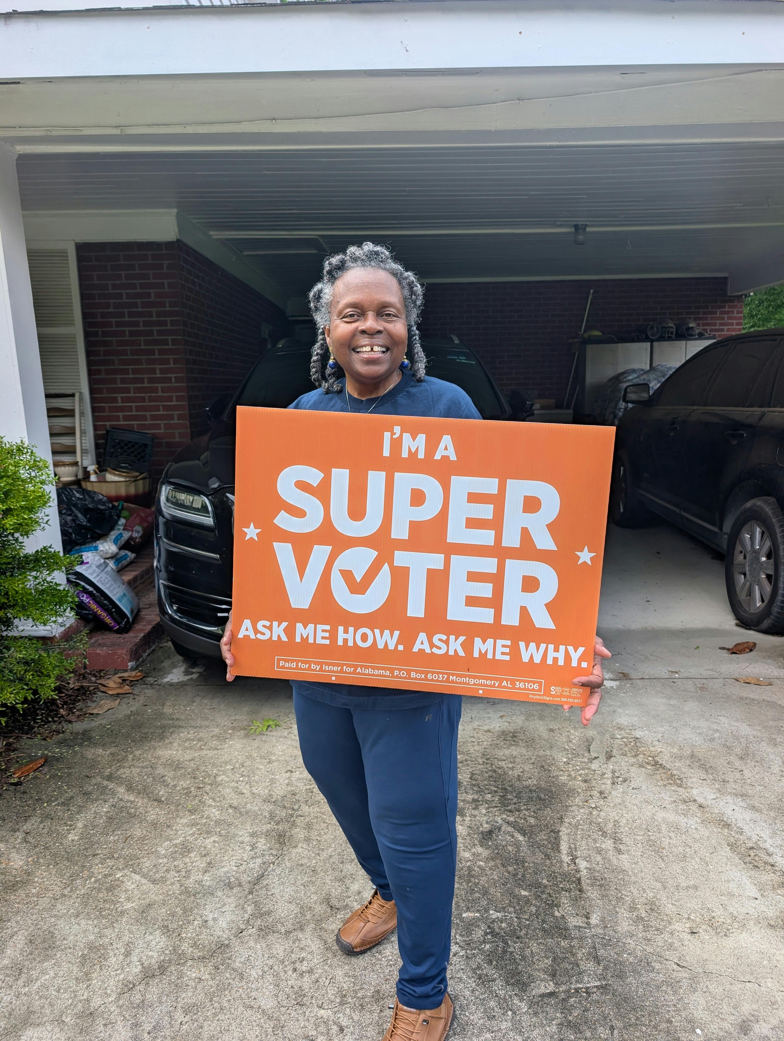 photo of supervoter holding a supervoter sign