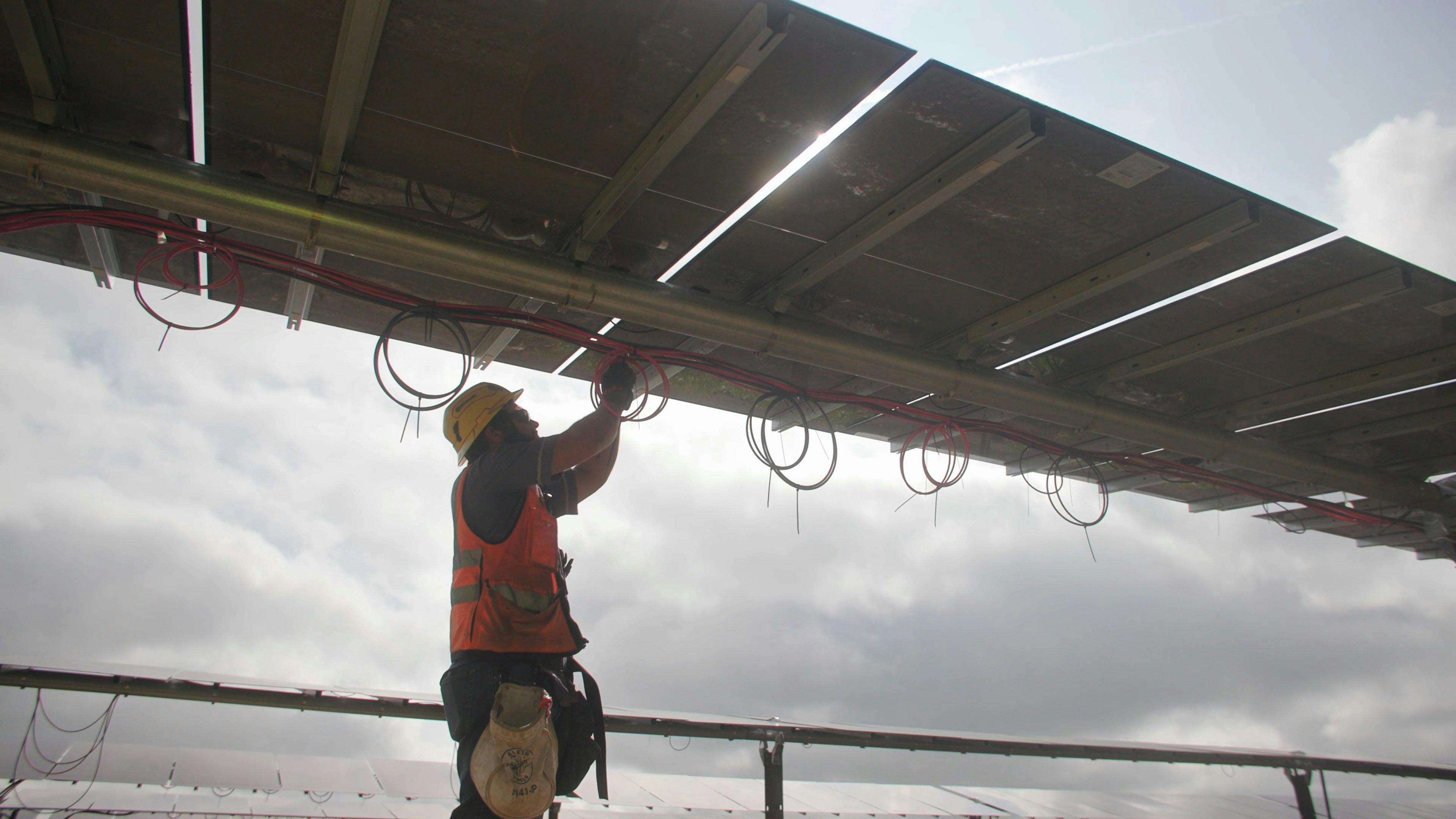 Electrician working on solar panels