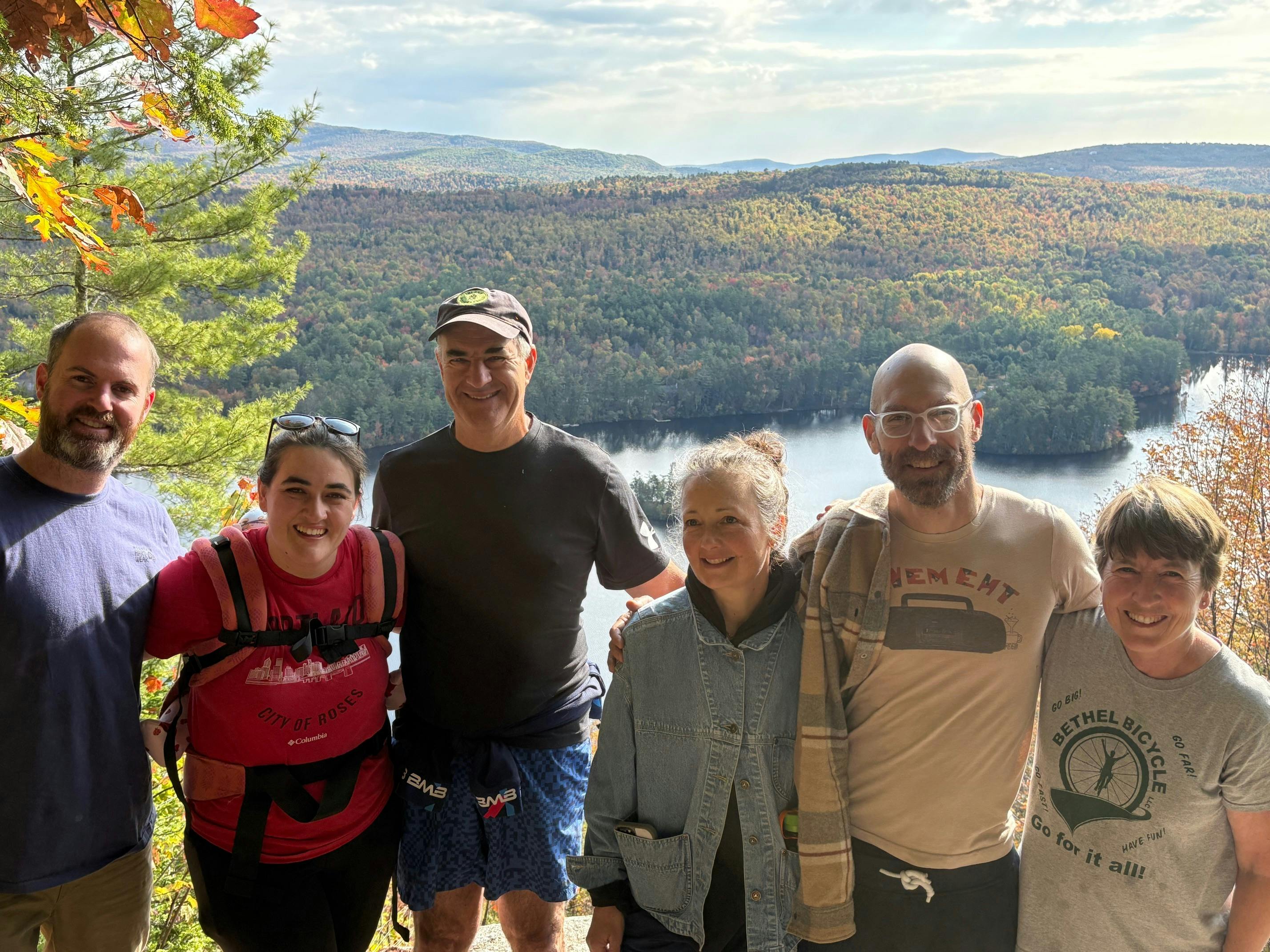 Portrait of candidate and others in front of scenic river view