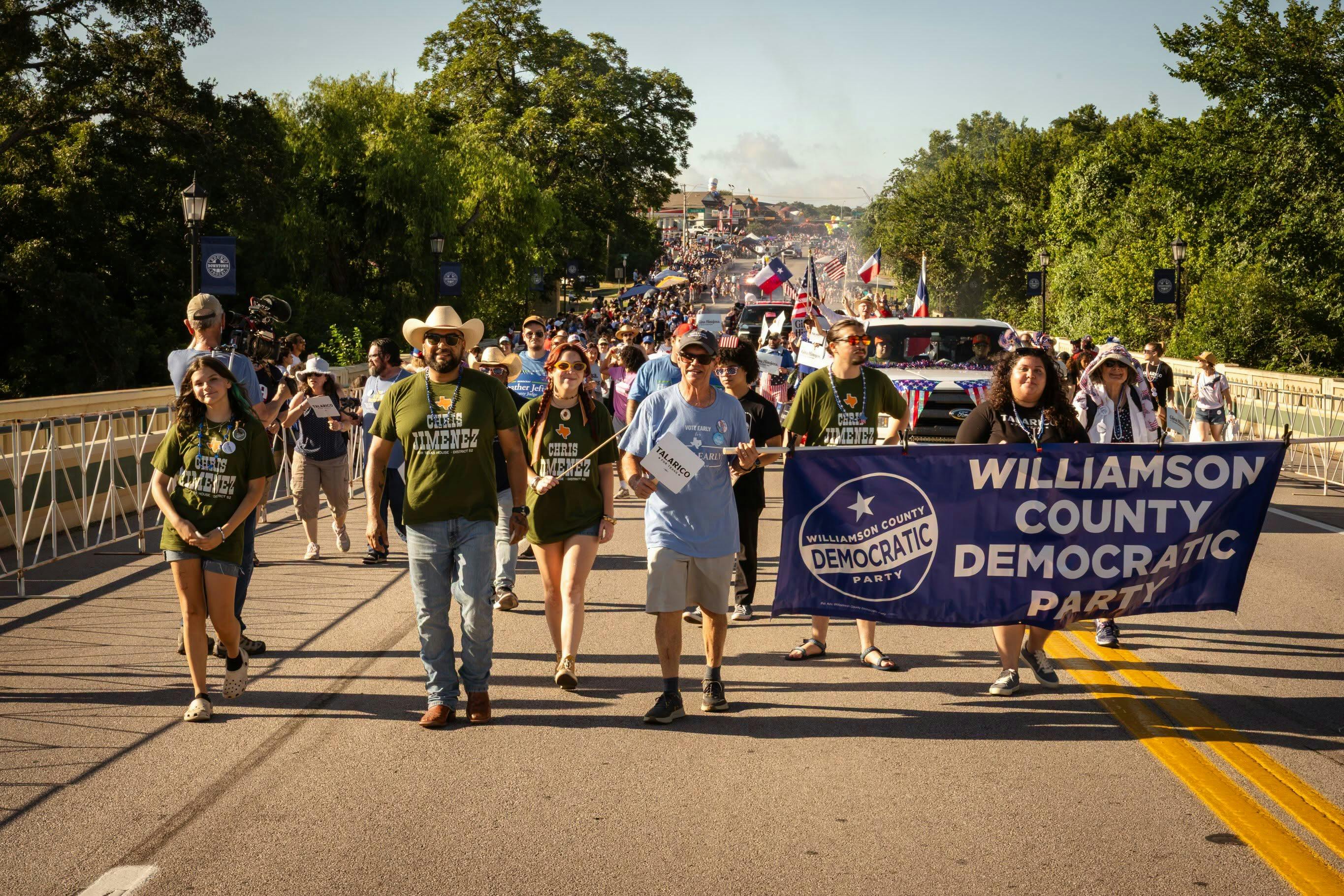 Chris Jimenez walking in a 4th of July Parade
