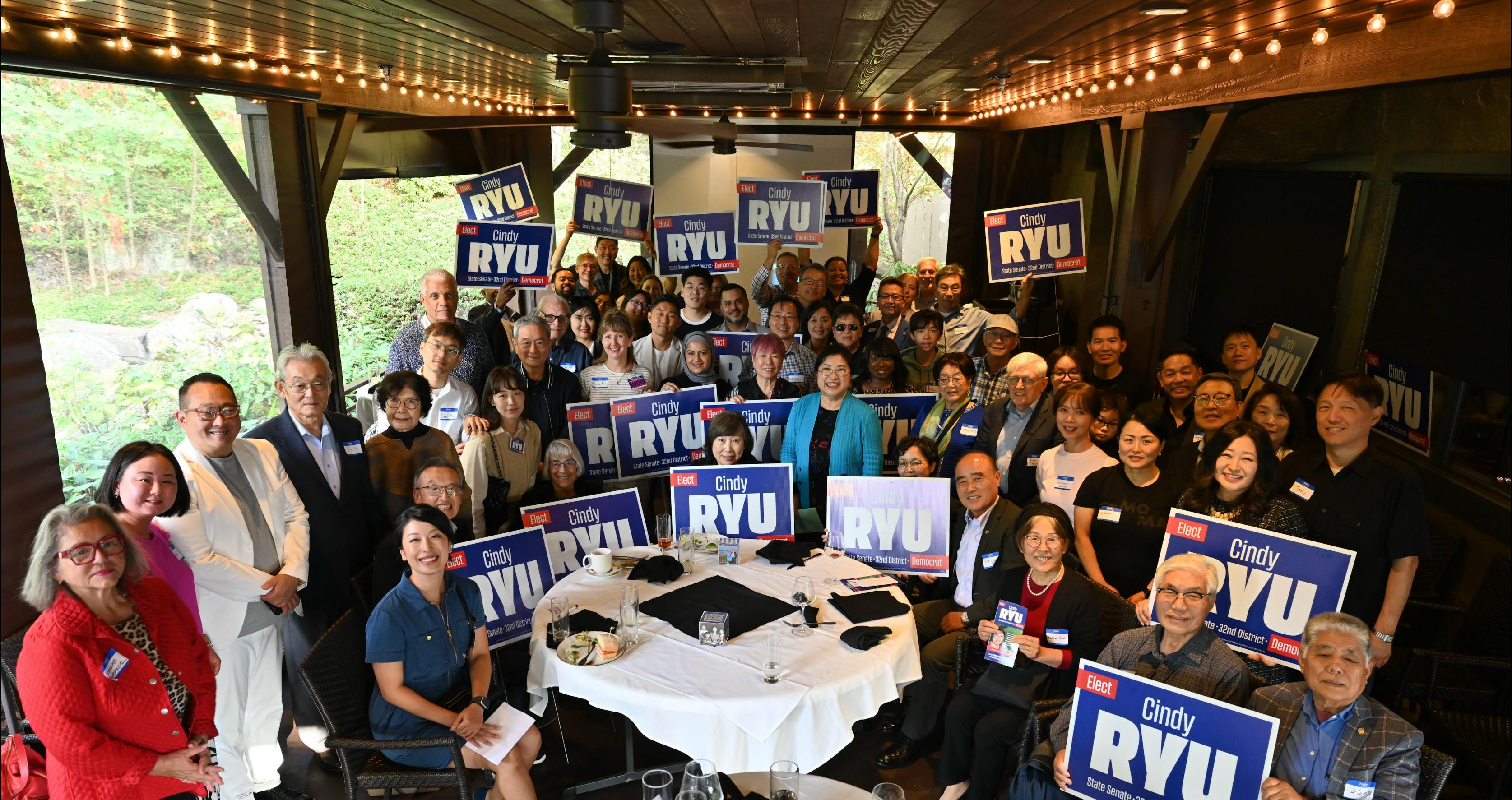 group of supporters holding Cindy Ryu for Senate signs