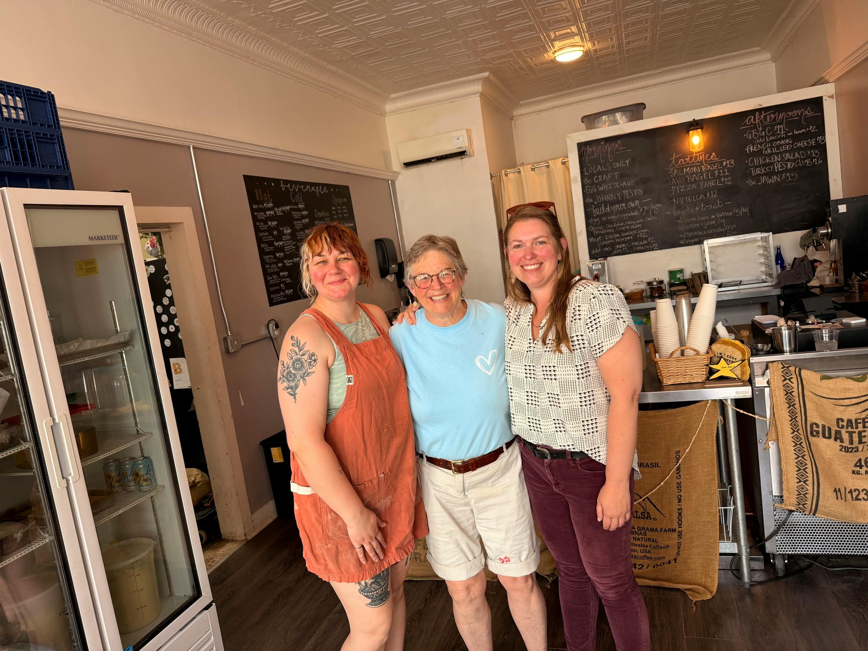 Katie Clendaniel with two community members at a local café