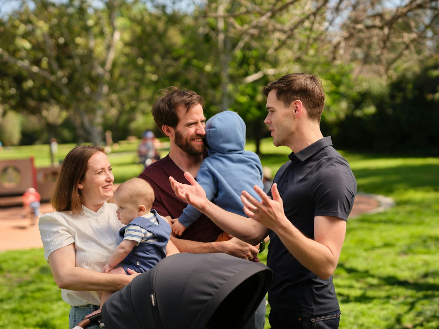Jake talking to a family at the park.