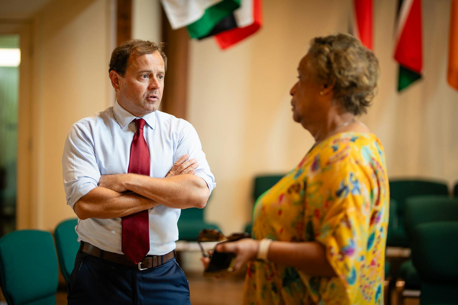 Tom speaking with woman