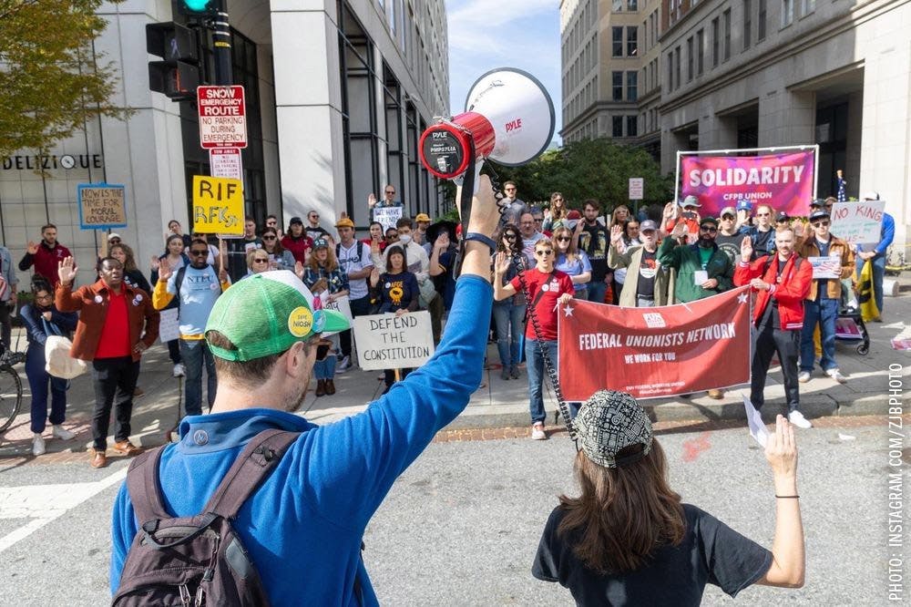 Alexis speaking before a protest.