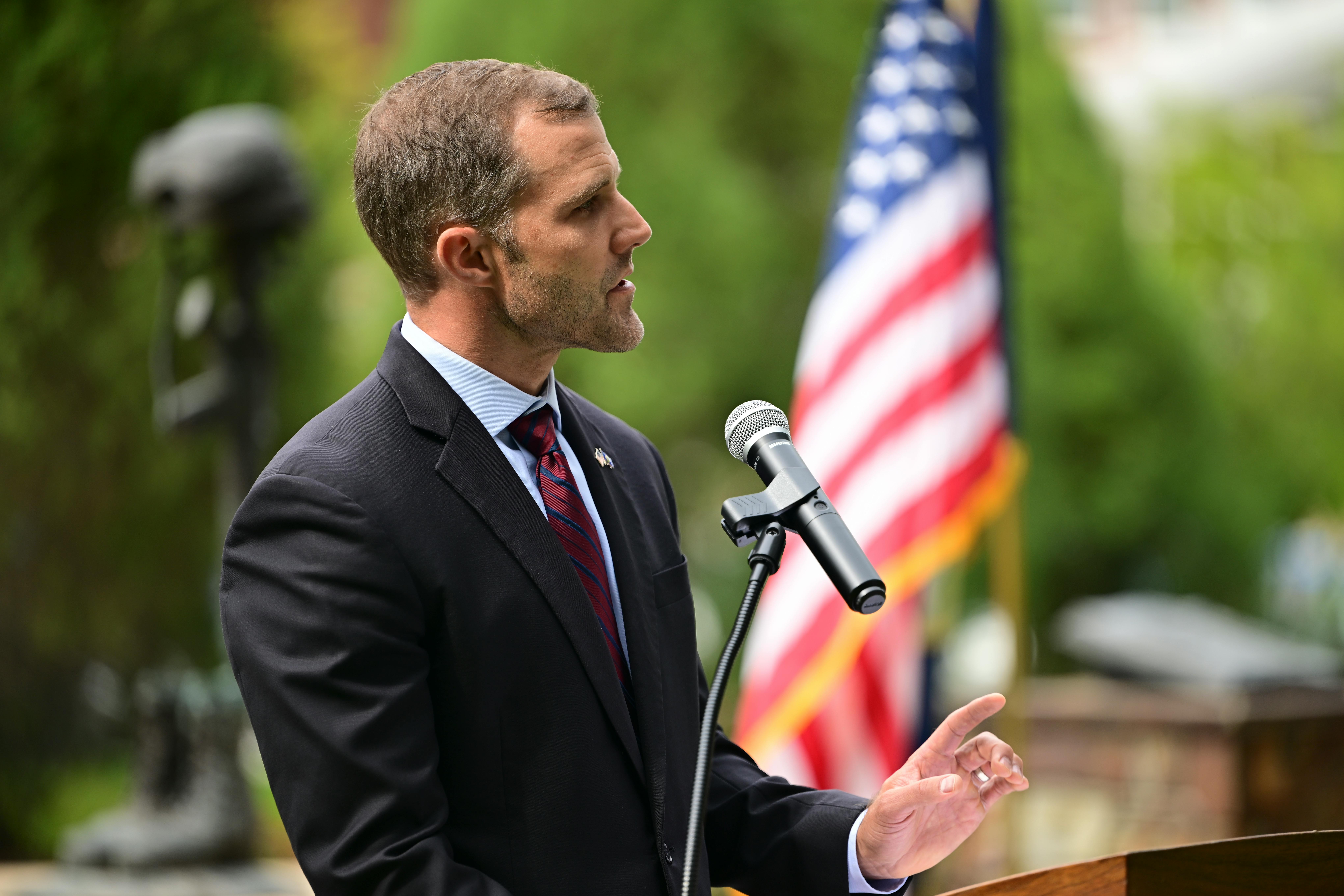 Seth speaking before a crowd. 