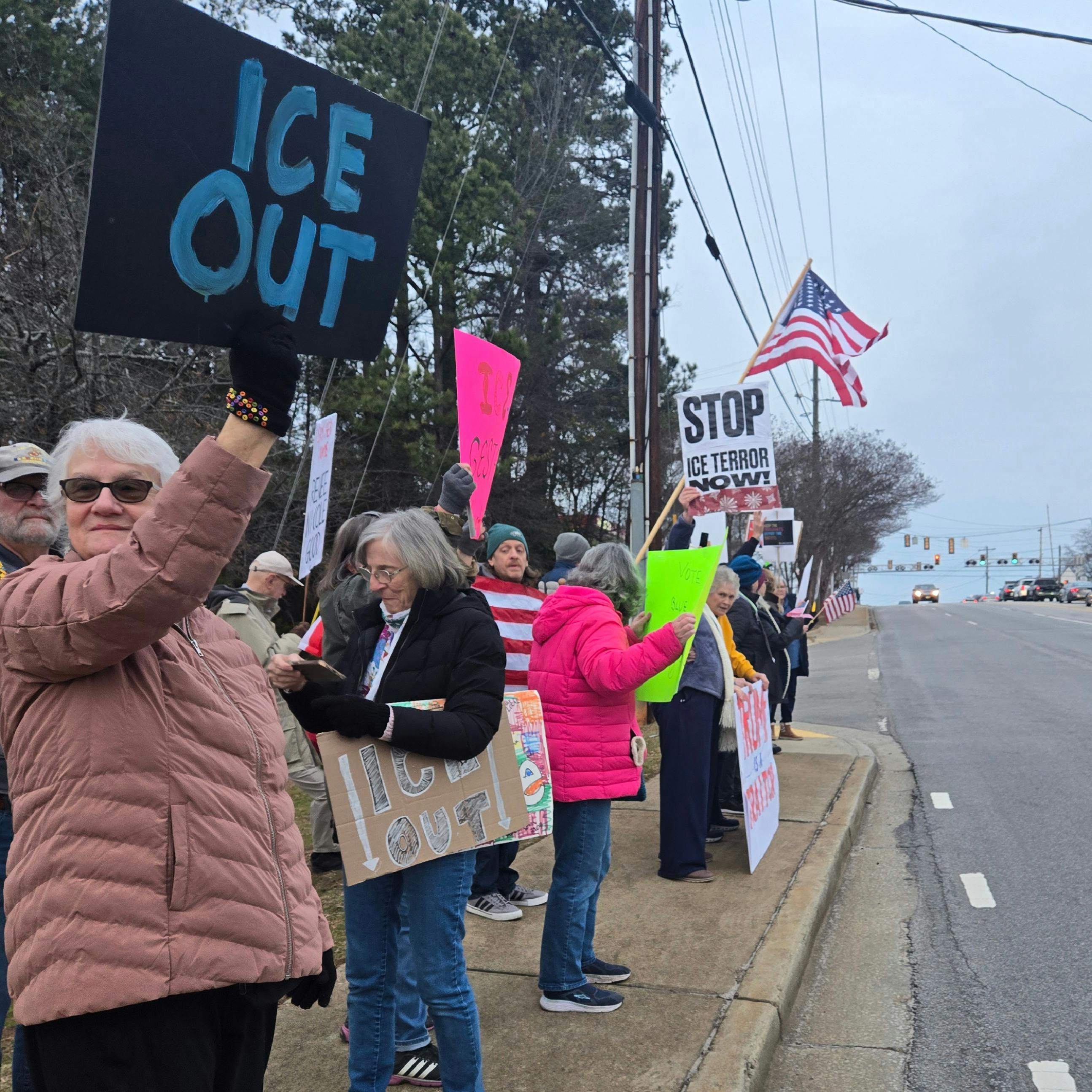 ICE Protestors holding signs