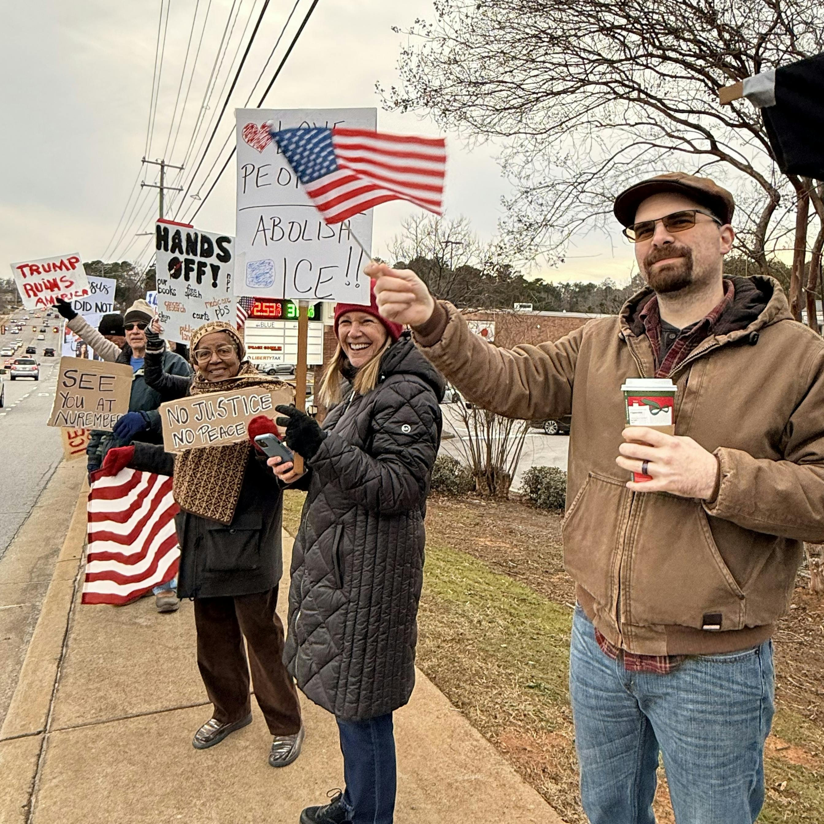 Protestors on a sidewalk