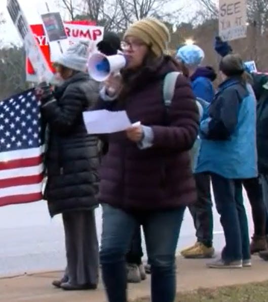 Julie on the bullhorn at protest