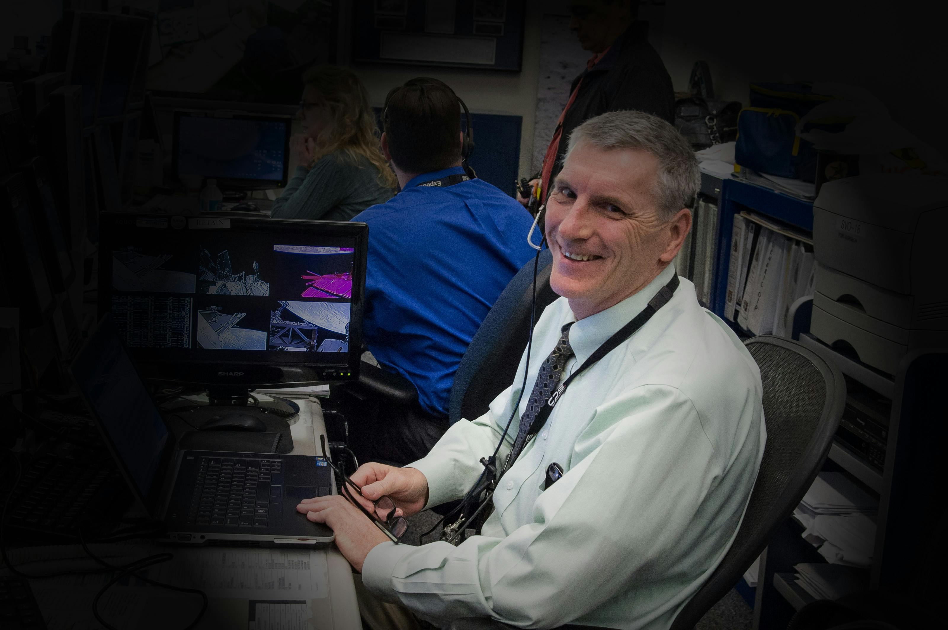 Dr Pete Bauer working in Mission Control