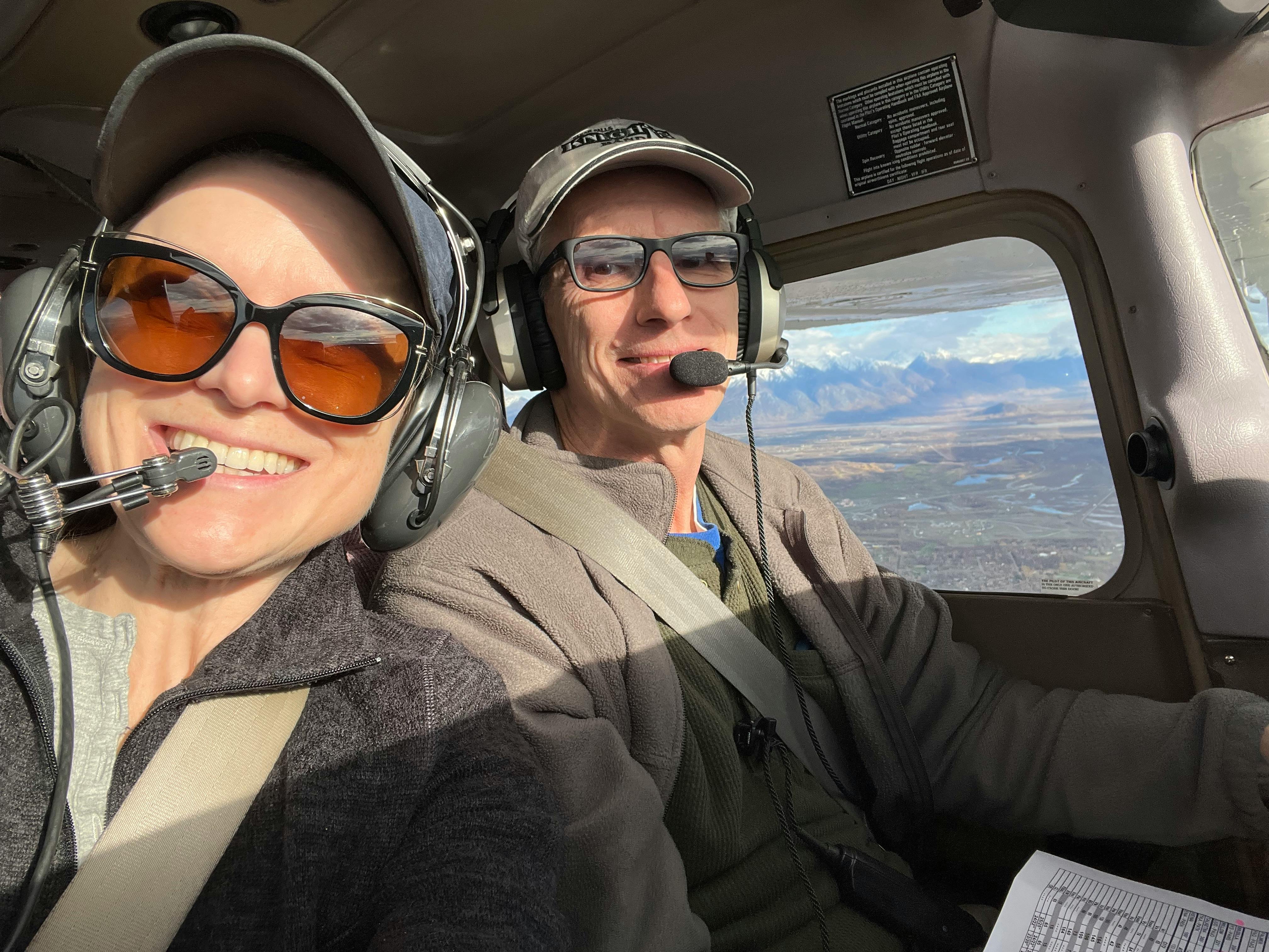 Dr Pete and LeeAnn flying over Settlers Bay
