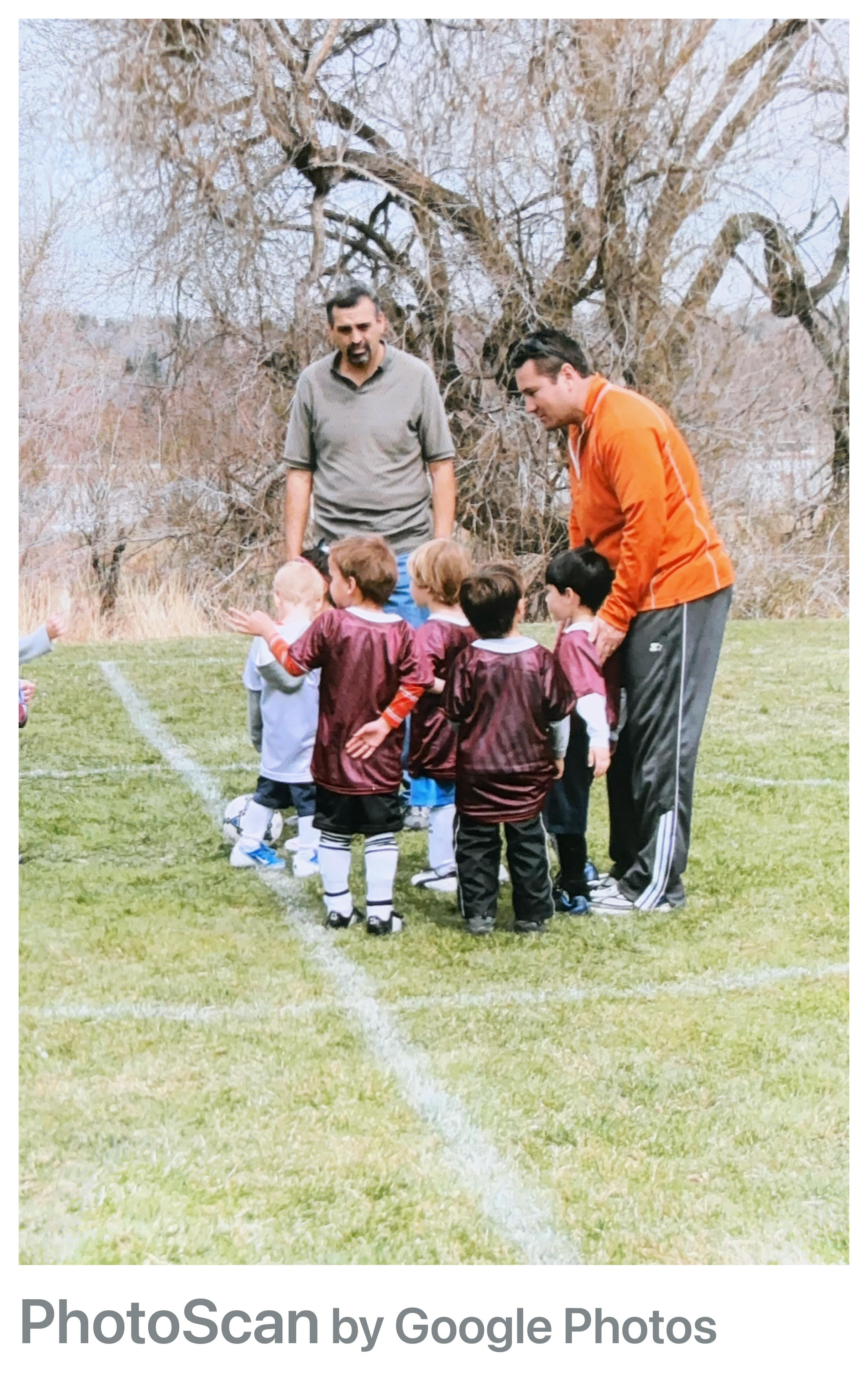 Paul coaching his son's soccer team