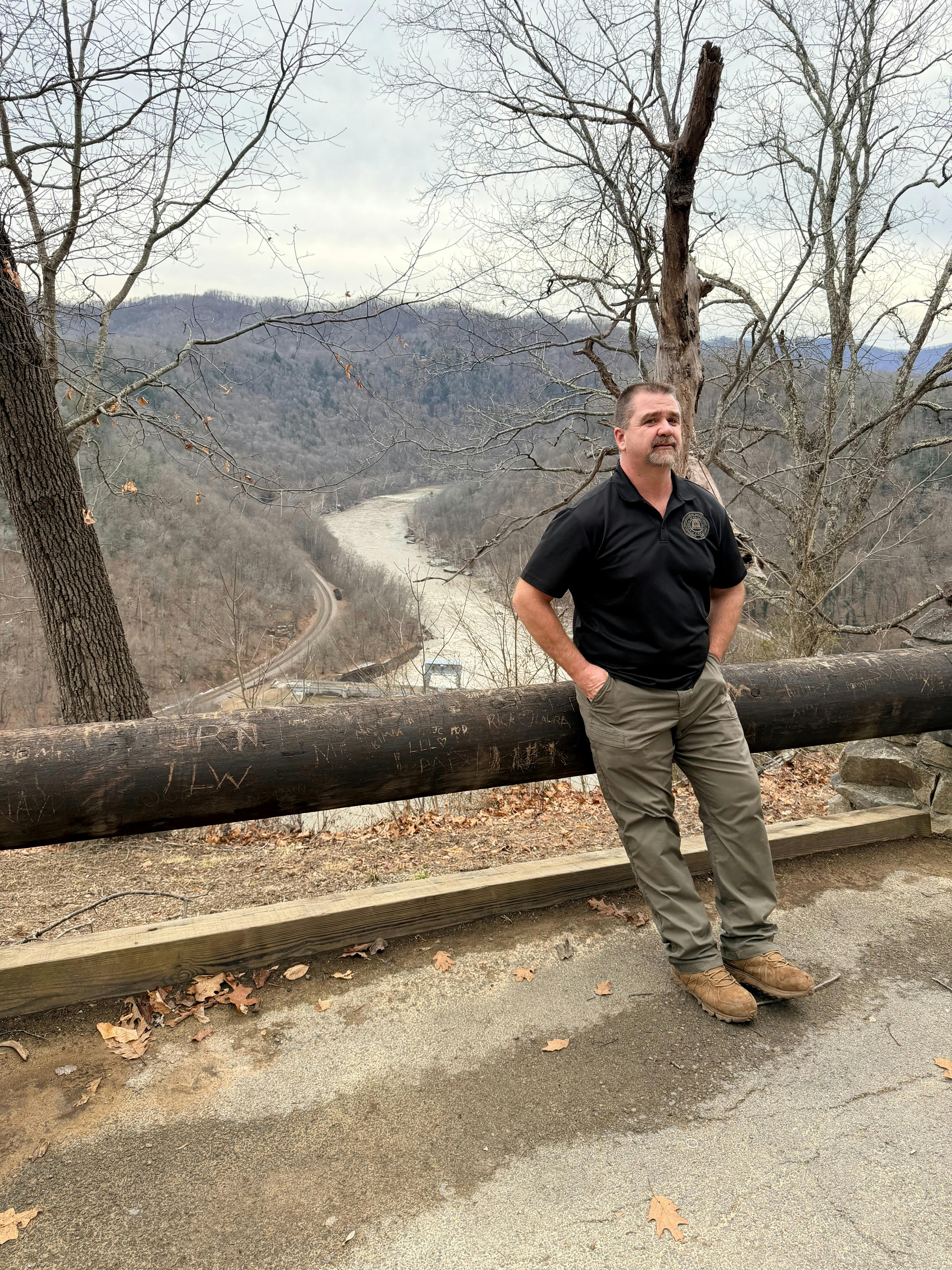 Kent standing with river in the background