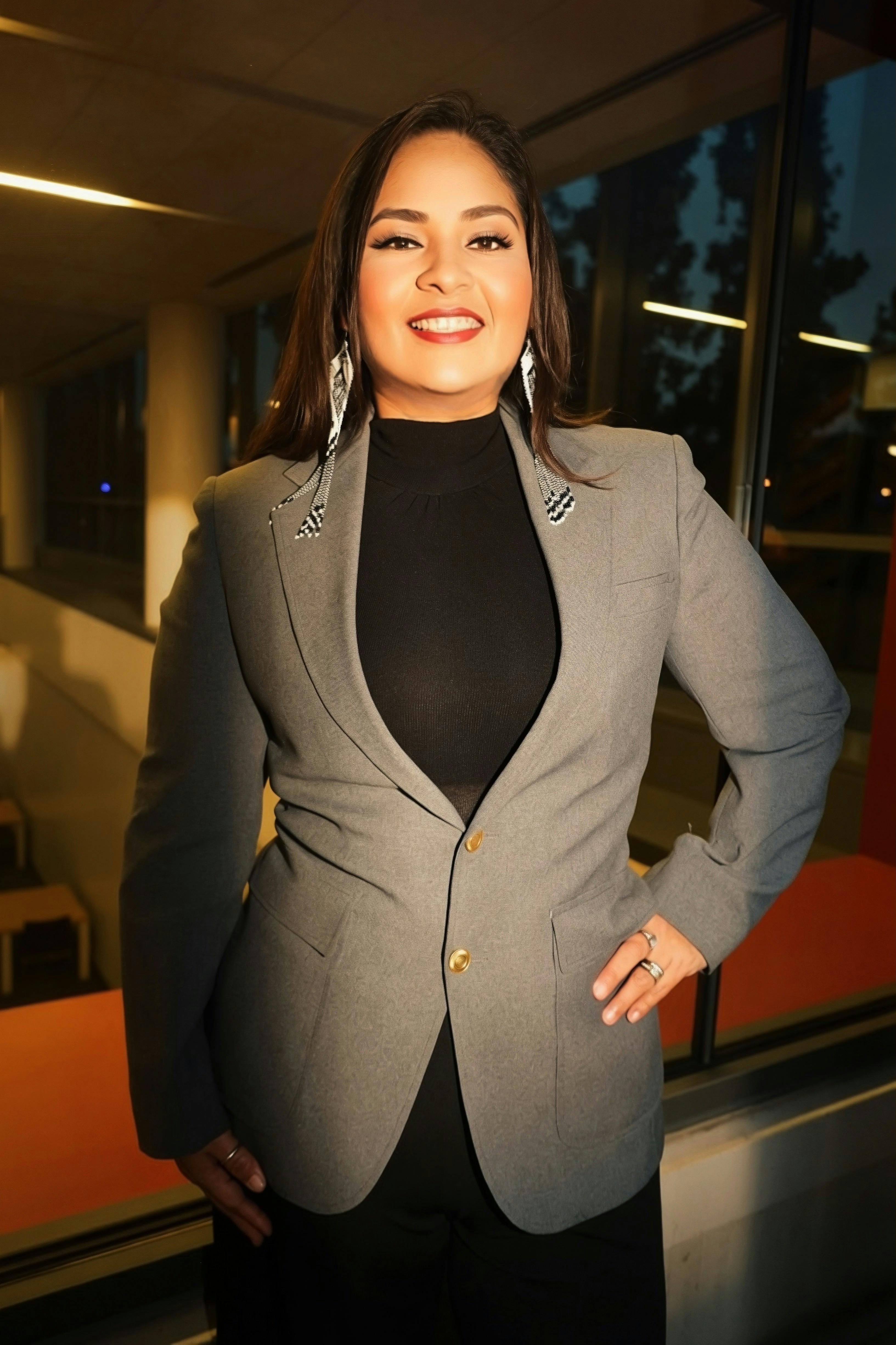Maria Pacheco smiling with group of people beside her