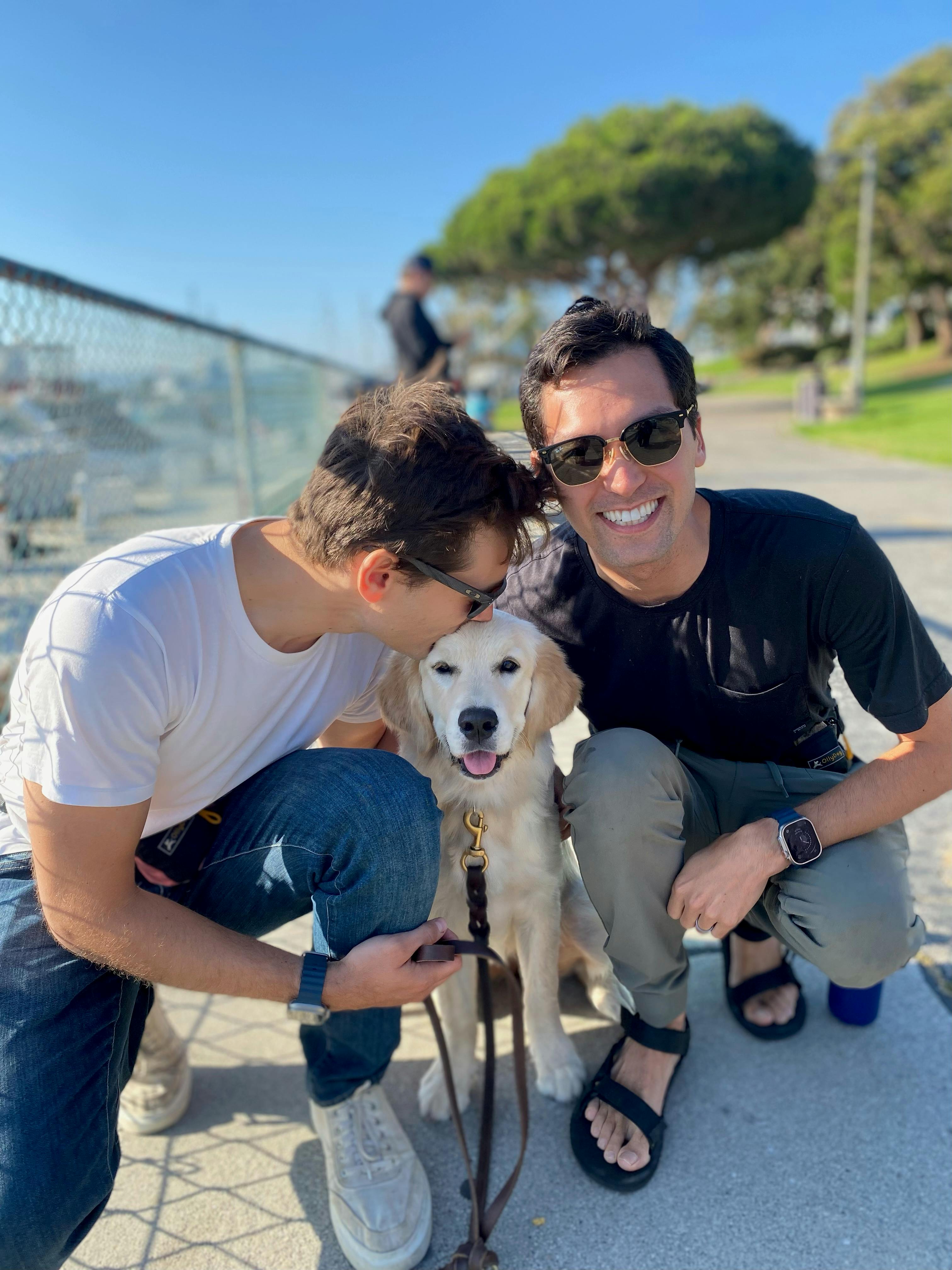 Jason Toups and his husband with their puppy, Gracie