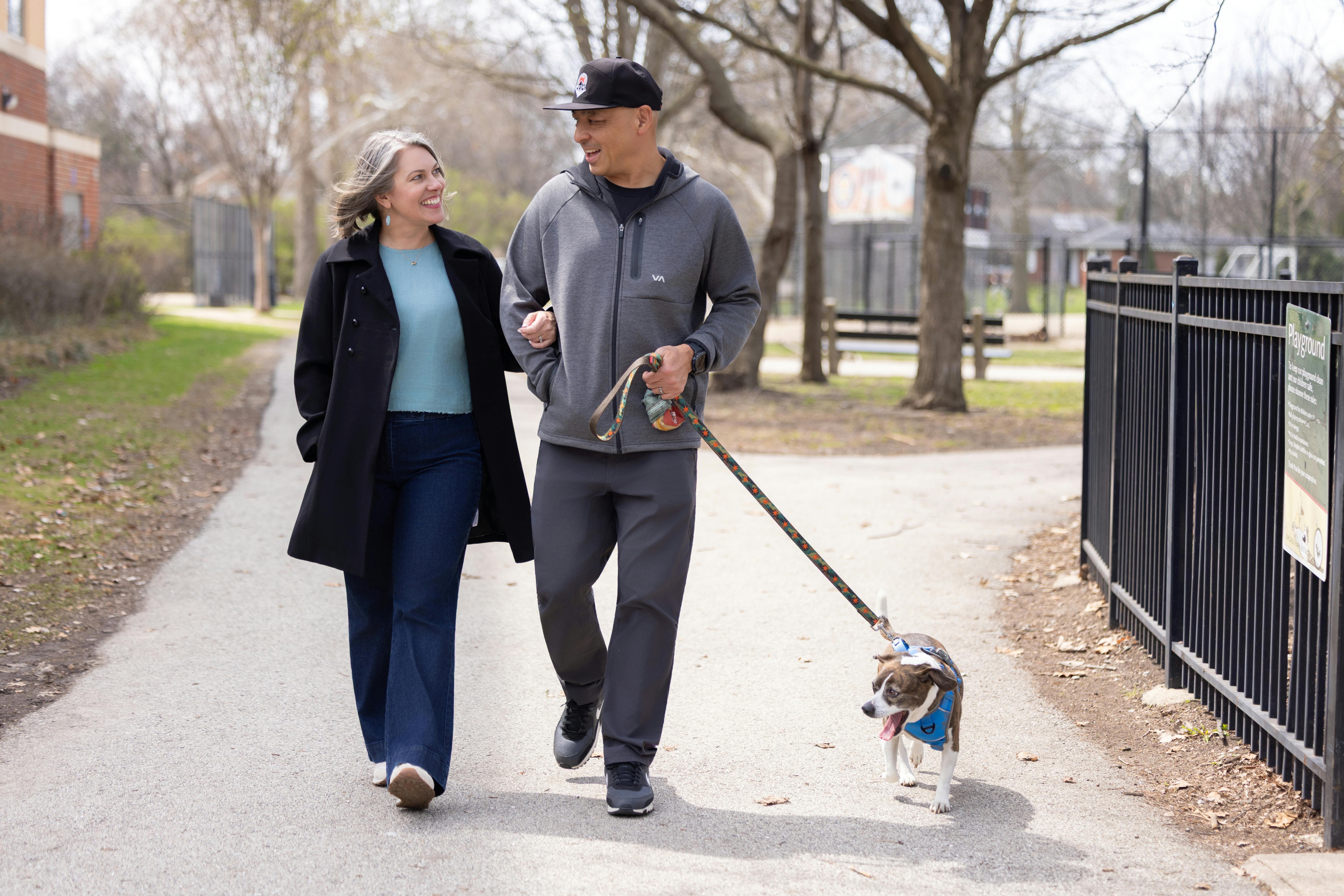 Leah and husband walking with dog
